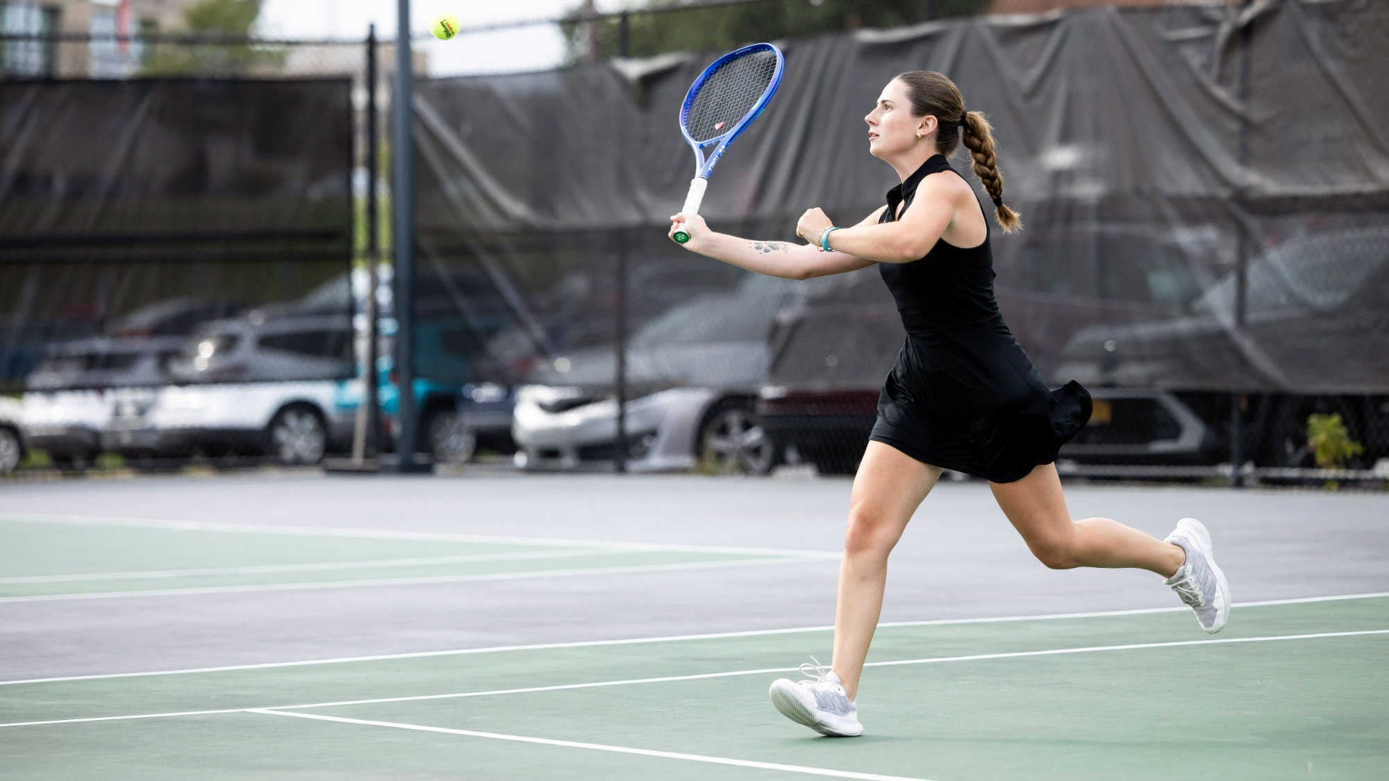 Ava Carey Hitting Tennis Ball