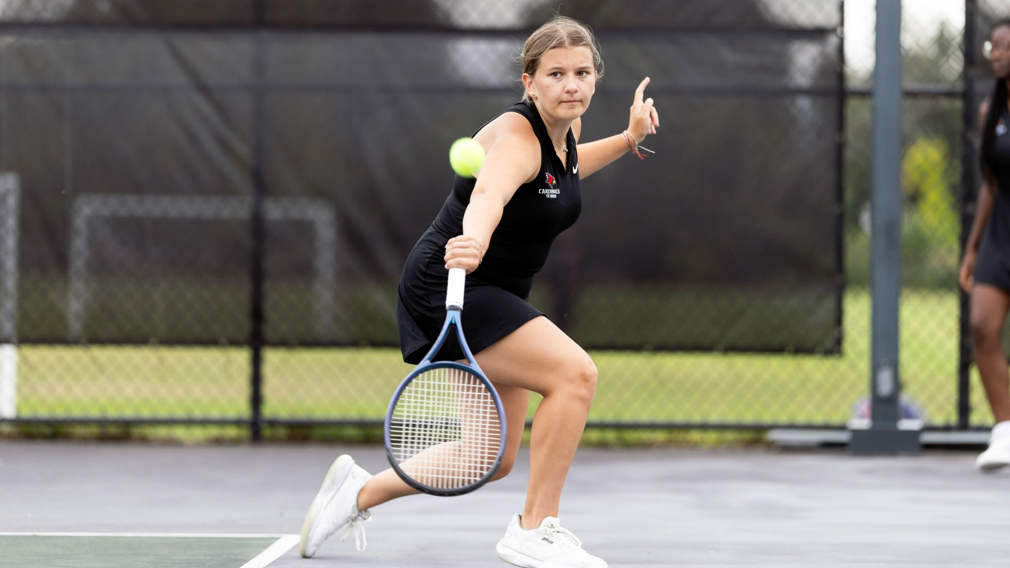 Ava Perry Hitting a Tennis Ball