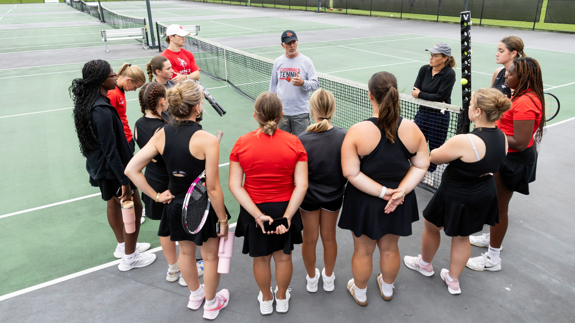 Women's Tennis Team in Huddle