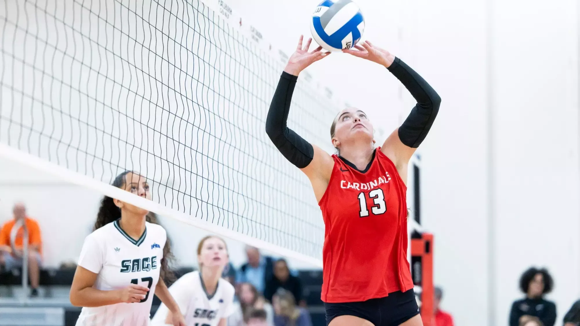 Emily O'Brien setting a volleyball