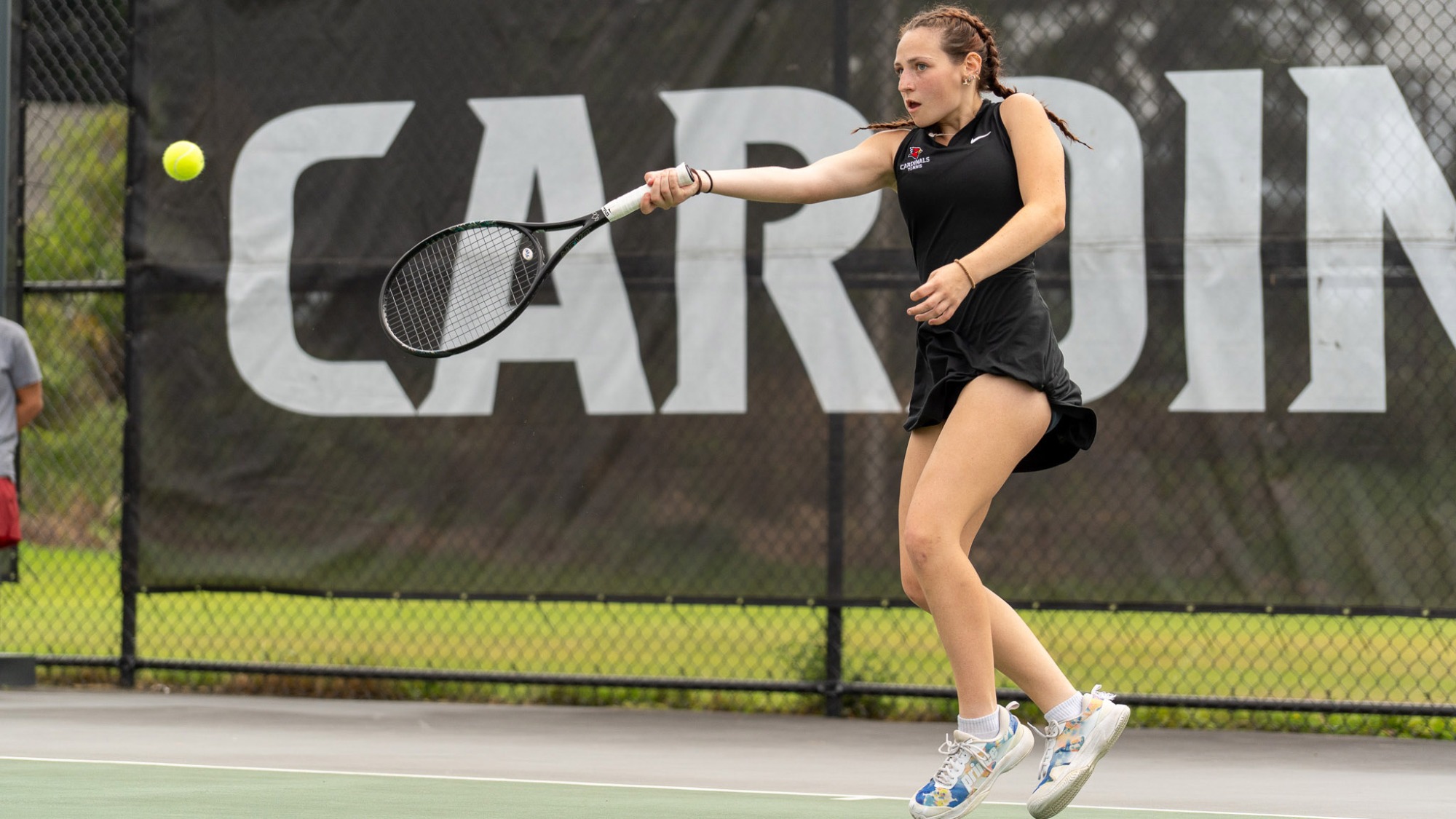 Abigail Macdougal hitting tennis ball