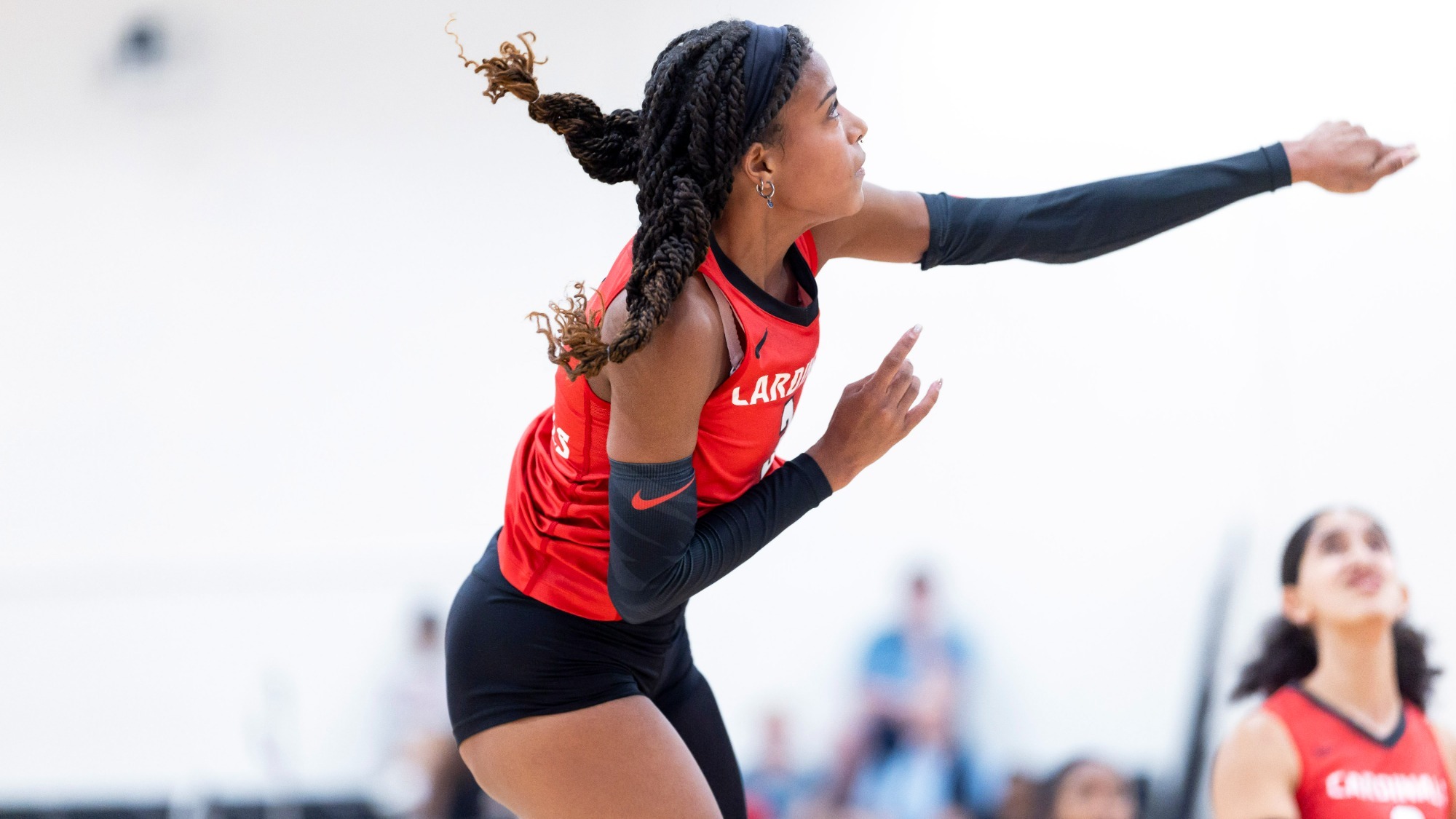 Darby Collyear swining at volleyball.