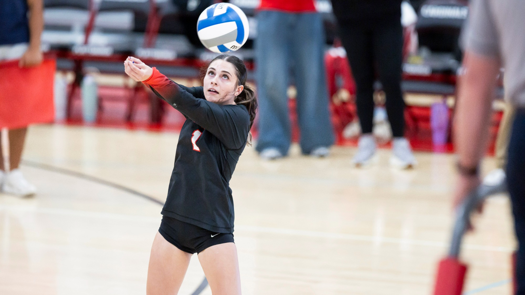 KC Burke bumping a volleyball