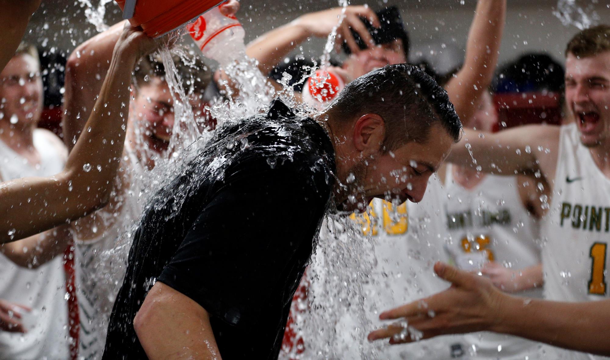 PacWest Men’s Basketball Championships: Coach Logie gets a bath after winning the title