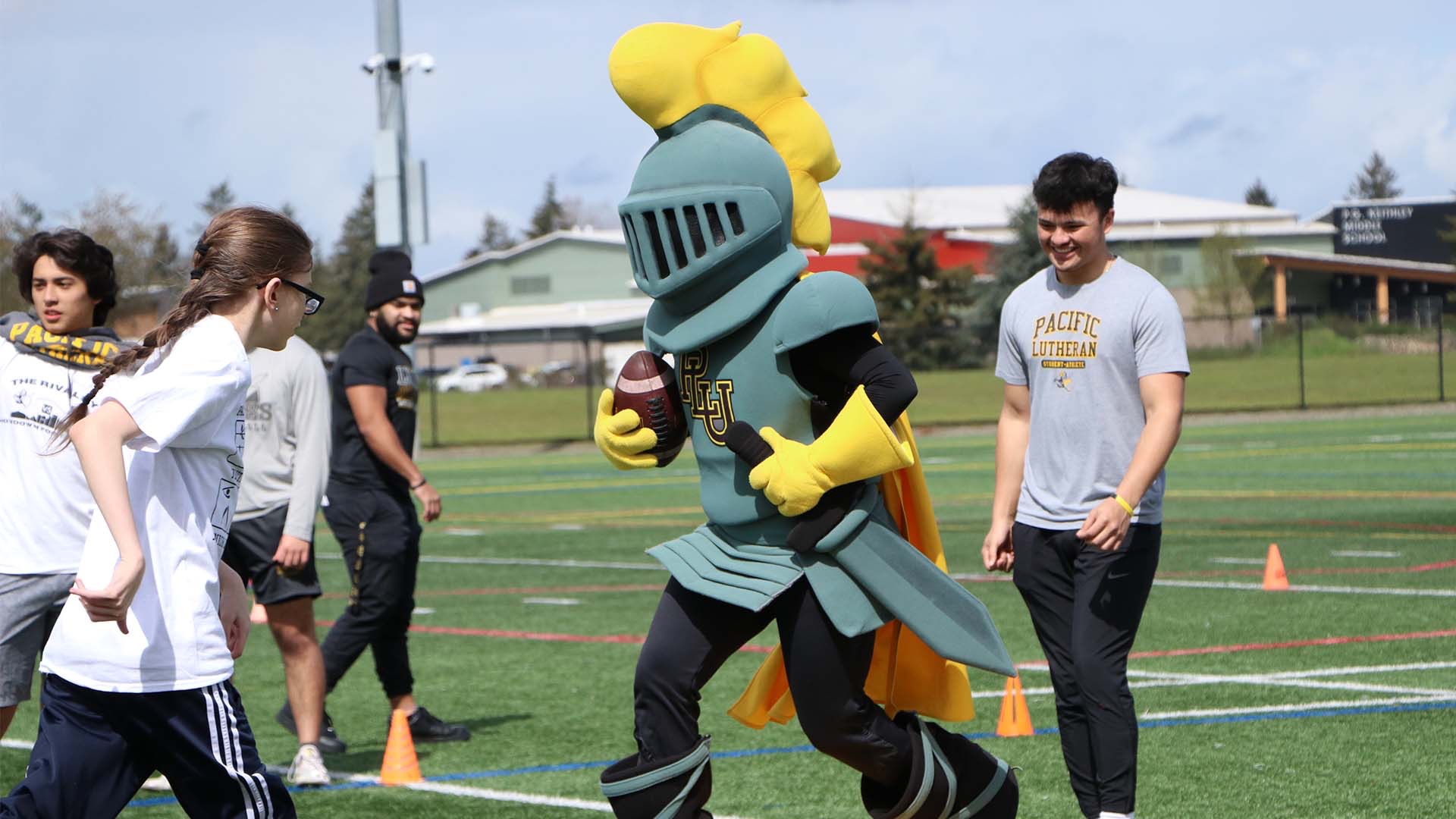 LanceLute Playing Football at Youth Clinic