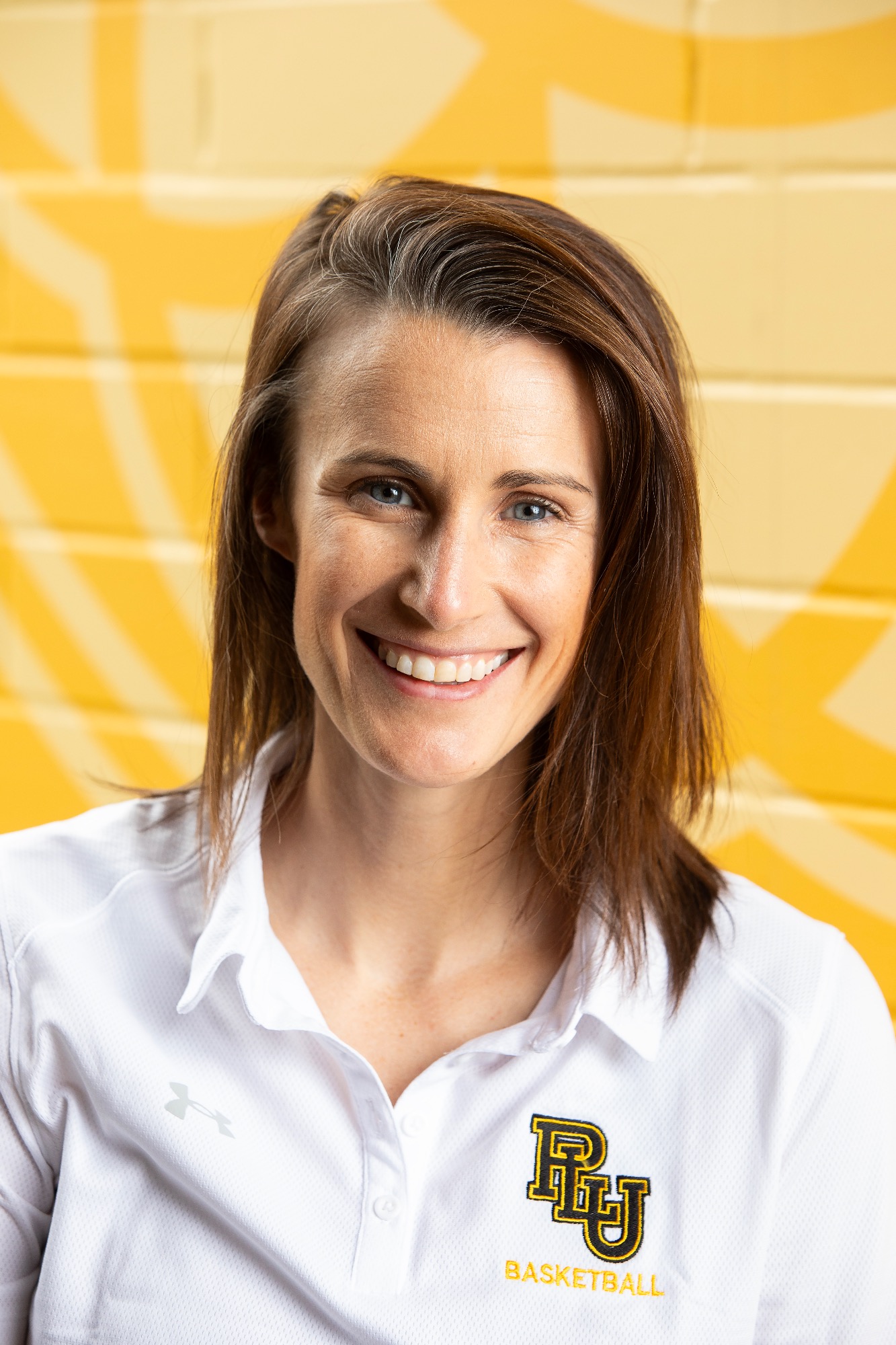 Lee Aduddell, Head Coach for Women’s Basketball, poses for a new staff portrait, Wednesday, Aug. 21, 2024, at PLU. (PLU Photo / Sy Bean)