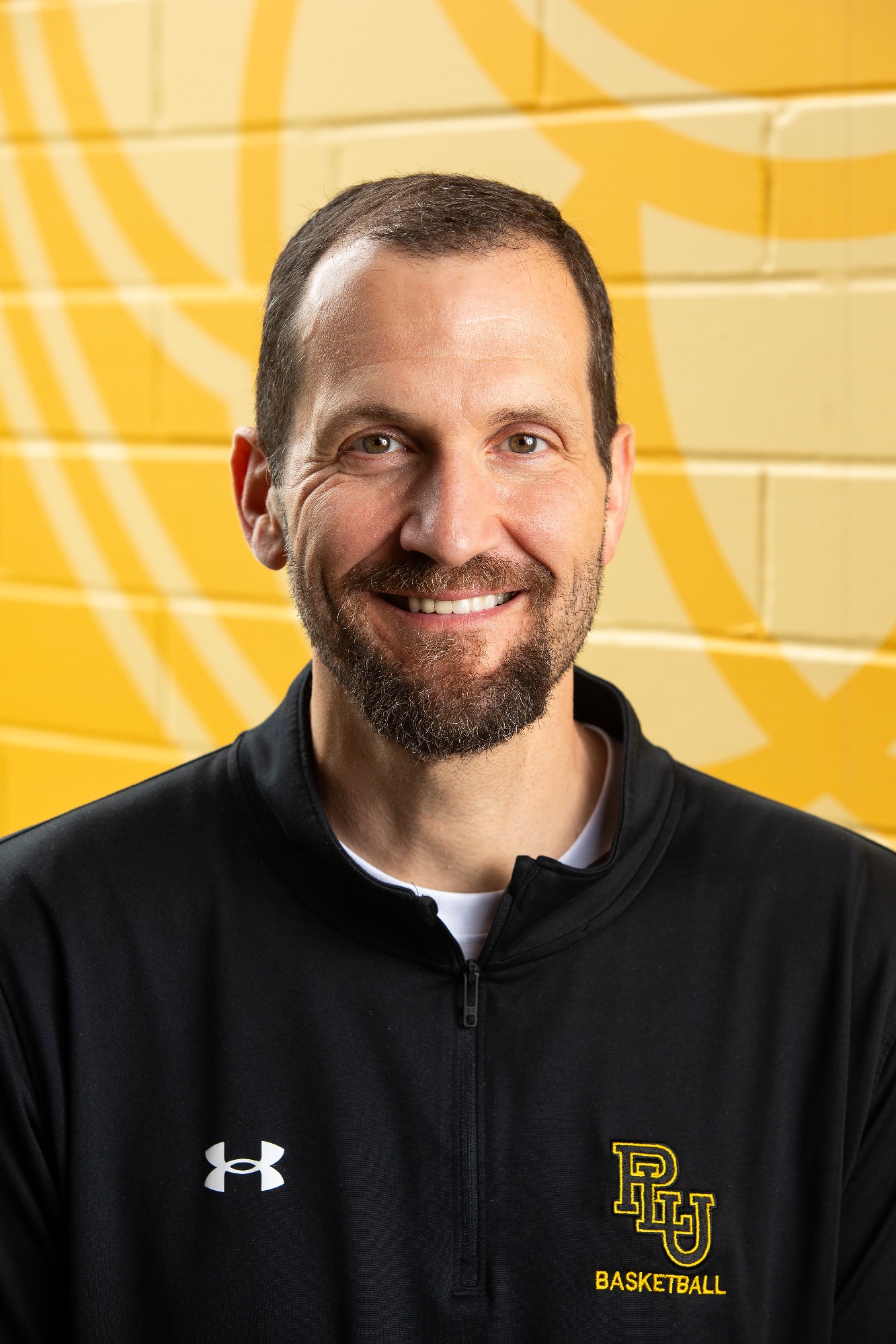 Chad Murray, Head Coach for Mens Basketball, poses for a new staff portrait, Wednesday, Aug. 21, 2024, at PLU. (PLU Photo / Sy Bean)