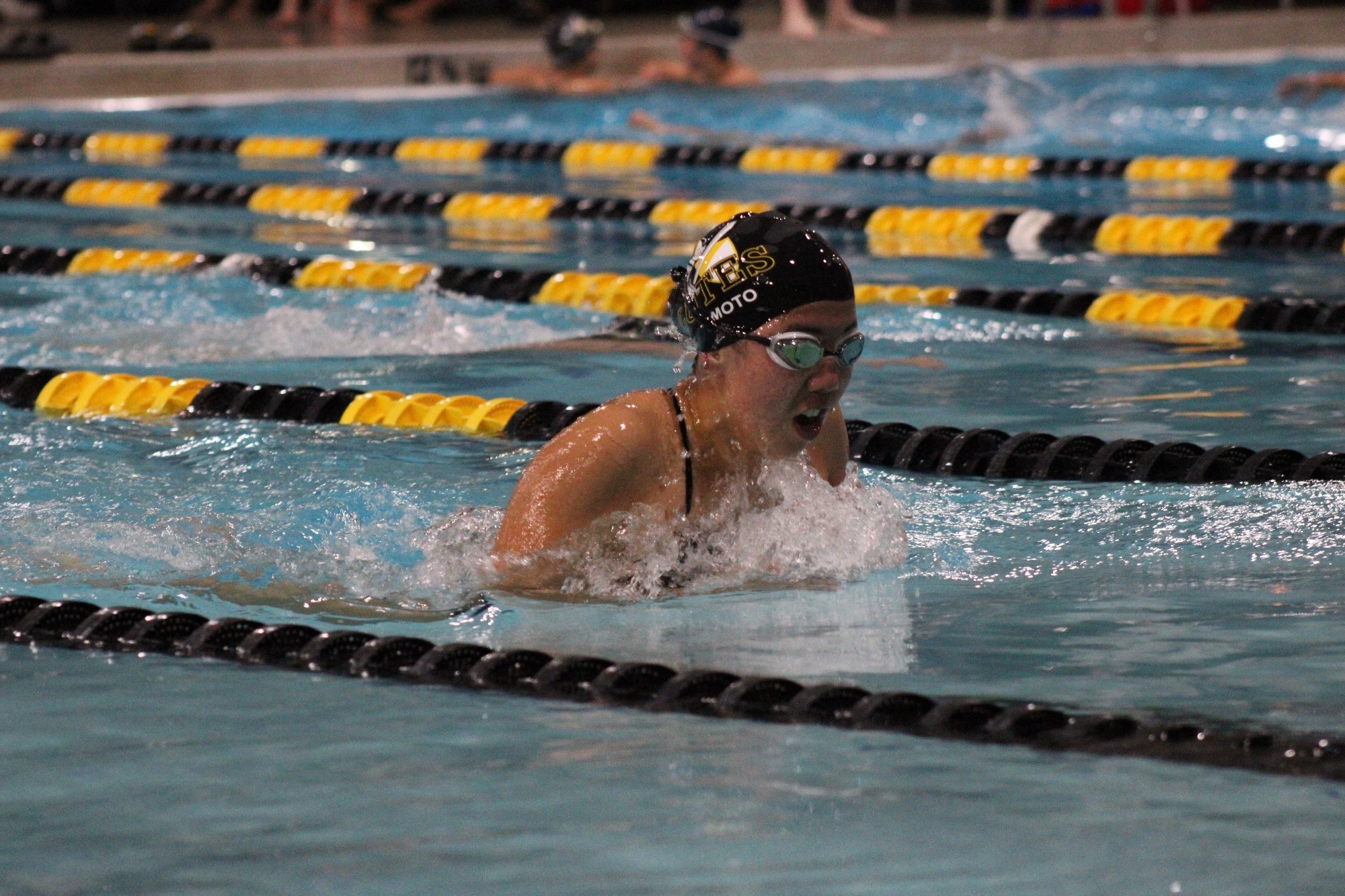 Keira Iwamoto swimming in exhibition vs La Verne