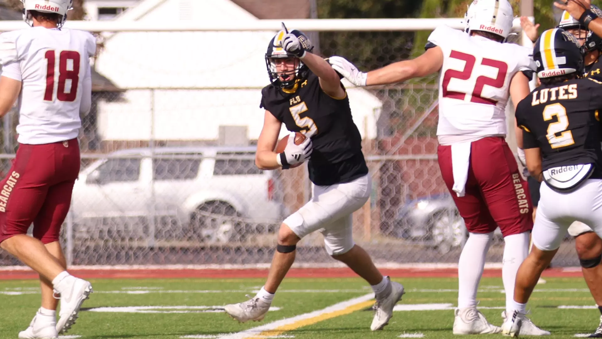 Cole Becker celebrates recovering fumble in PLU's 31-28 homecoming win over Willamette