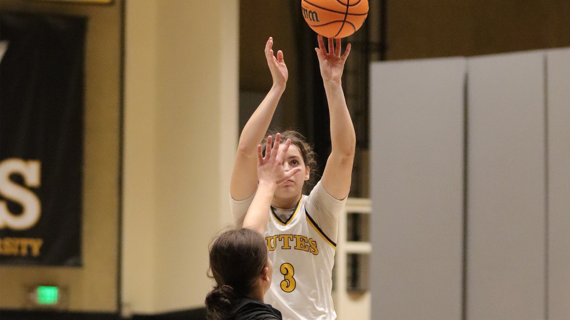 Kate Wooten shooting over Olympic College