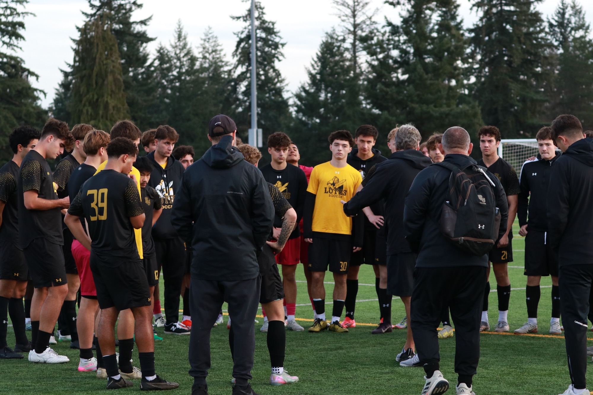team huddle on senior day