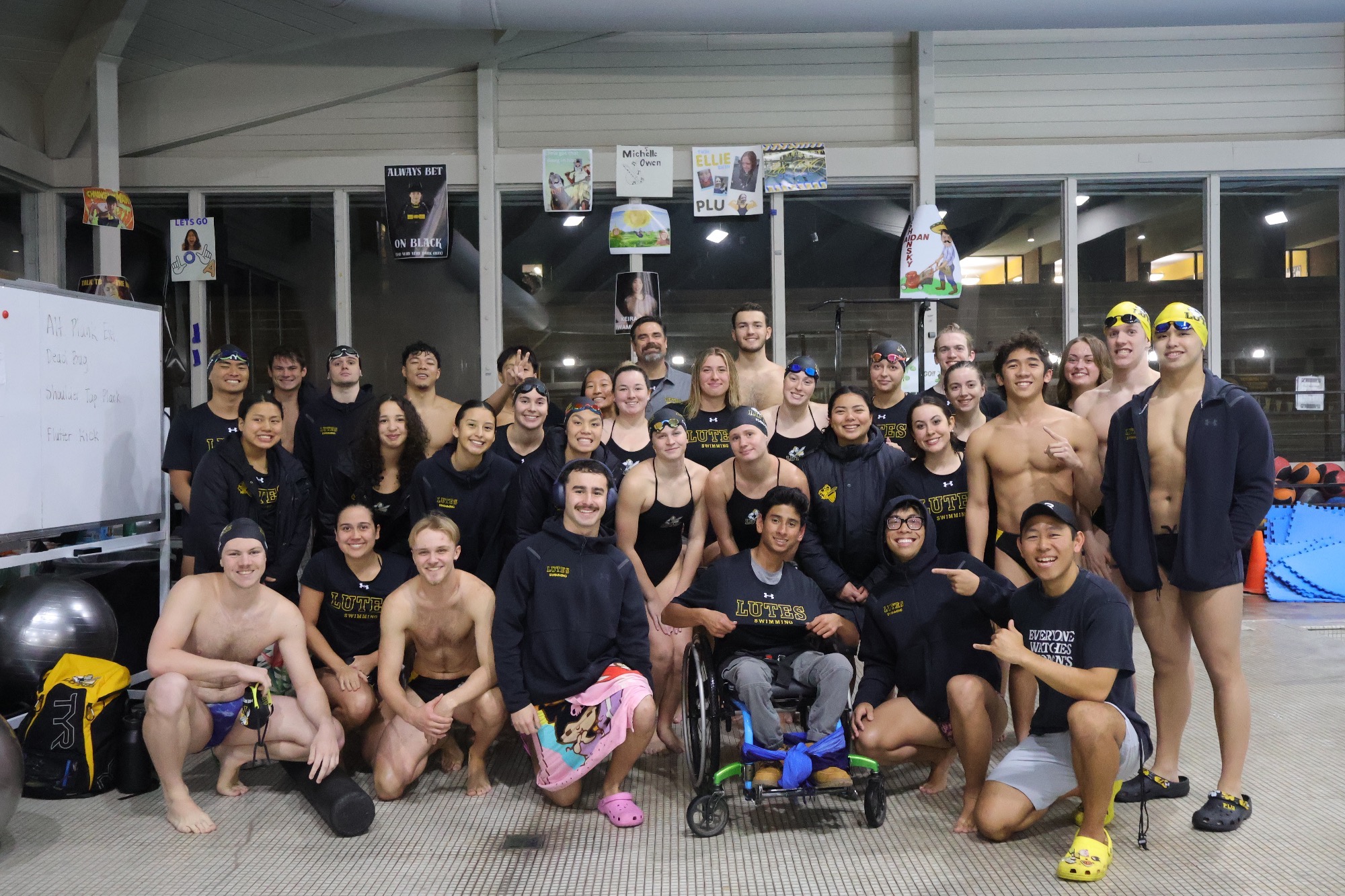 PLU swimming poses with Chris after the Team IMPACT signing day on Jan. 16