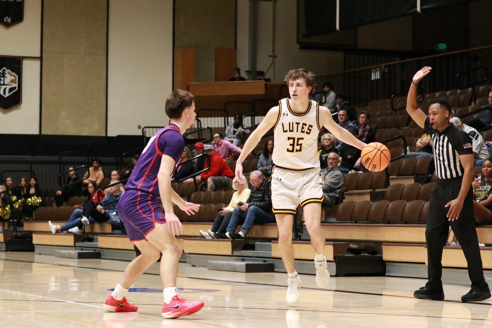 Shaun Burton dribbles past defender.