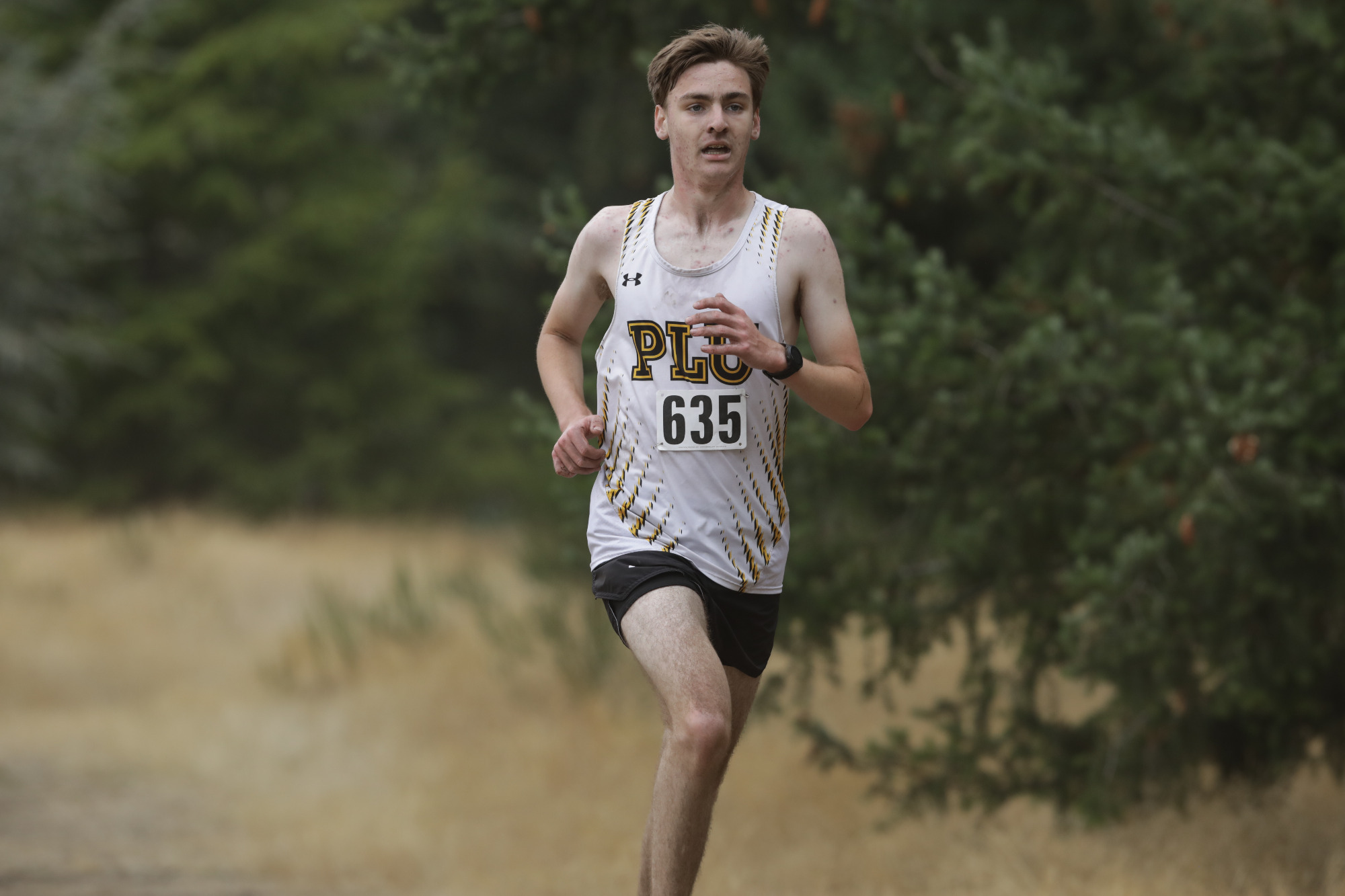 Garrett running at PLU Invite