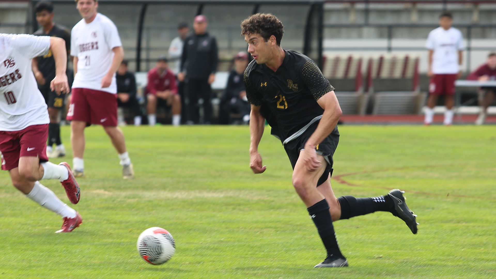 Misha Turnchaninov dribbles vs Puget Sound