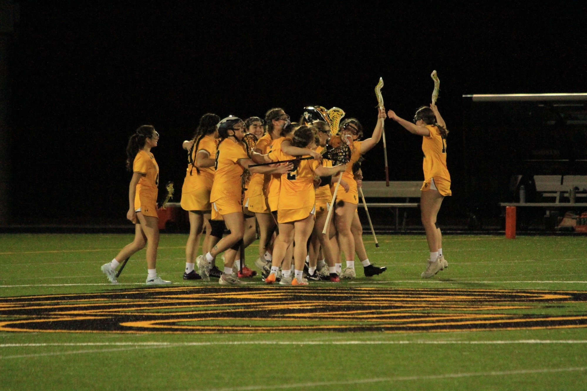 team celebrates win over Eastern Oregon