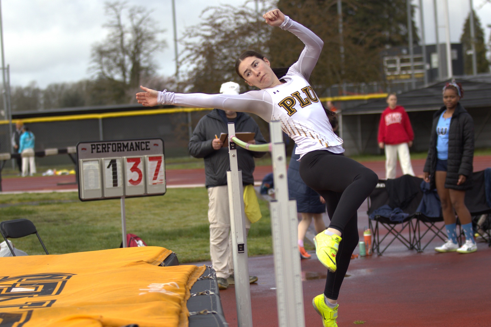 Caprye high jumping at Brad Moore Invite