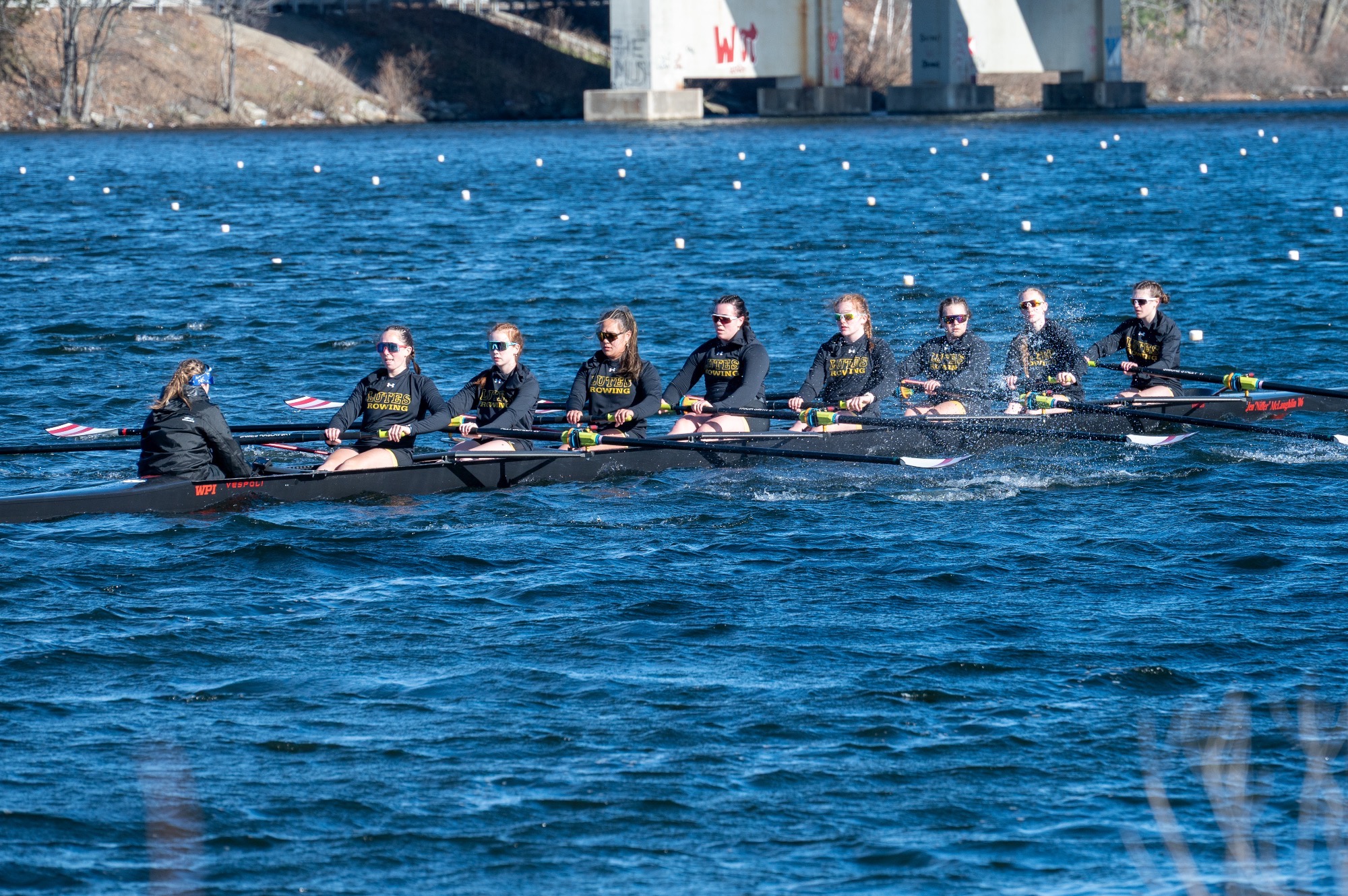varsity 8 rowing on Lake Quinsigamund in MA