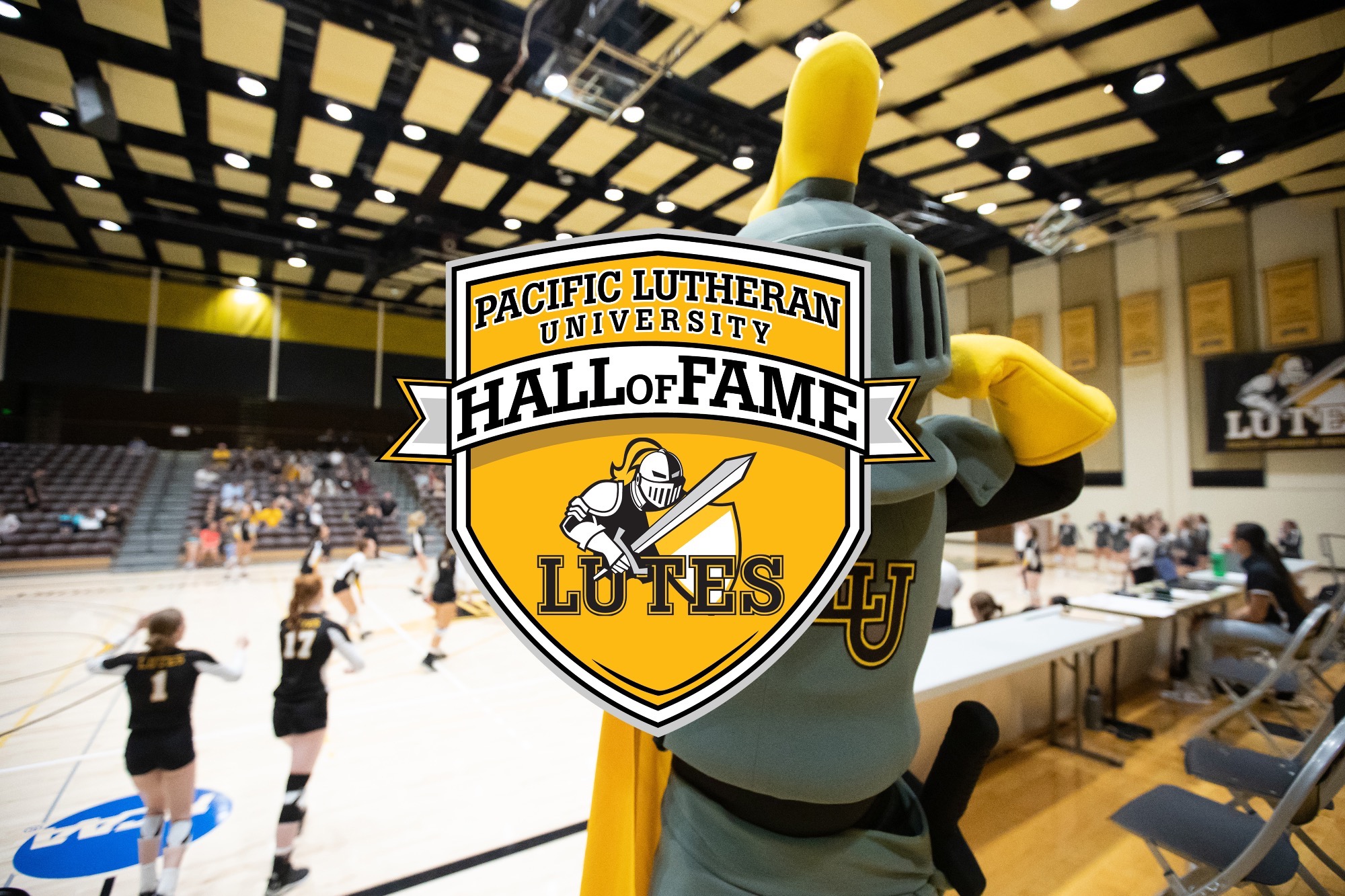 LanceLute at volleyball with the PLU Athletics Hall of Fame Logo