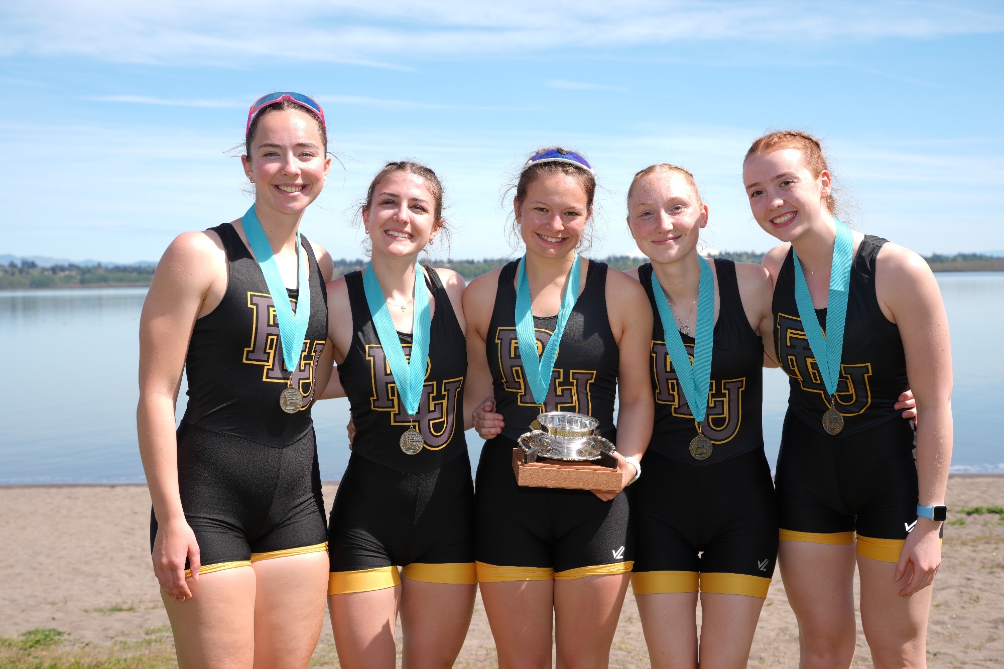 PLU's varsity four with medals after winning the Keith Buckley Cup