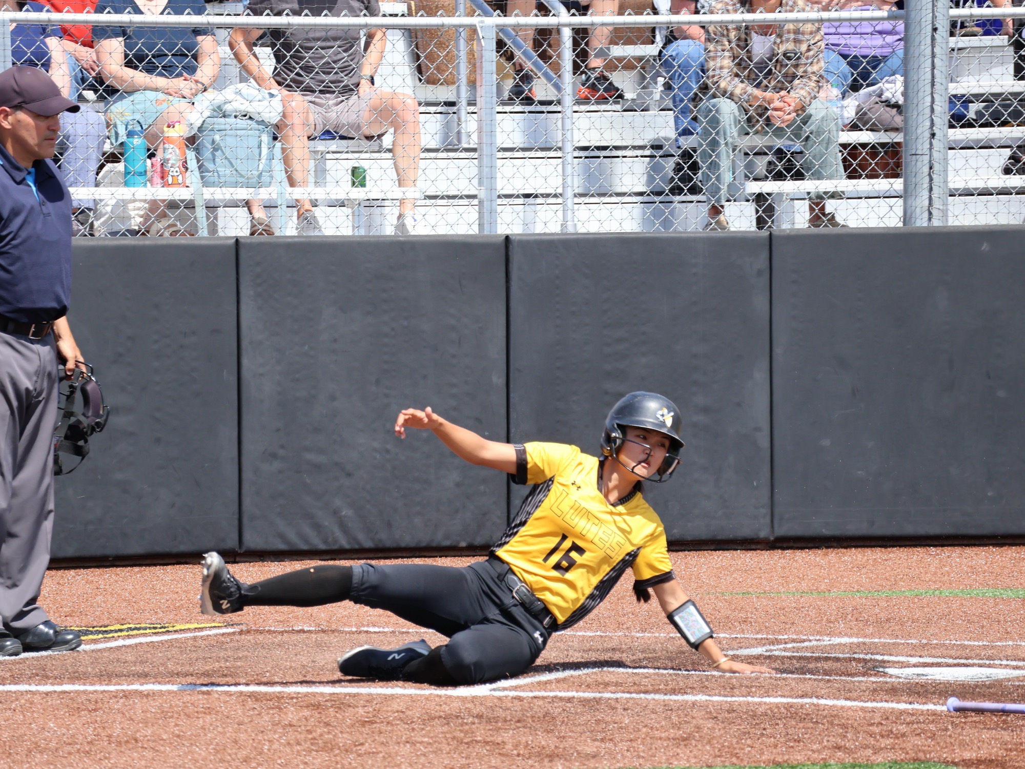 Syan Yamamoto sliding into home in win over L&C at NWC Tourney
