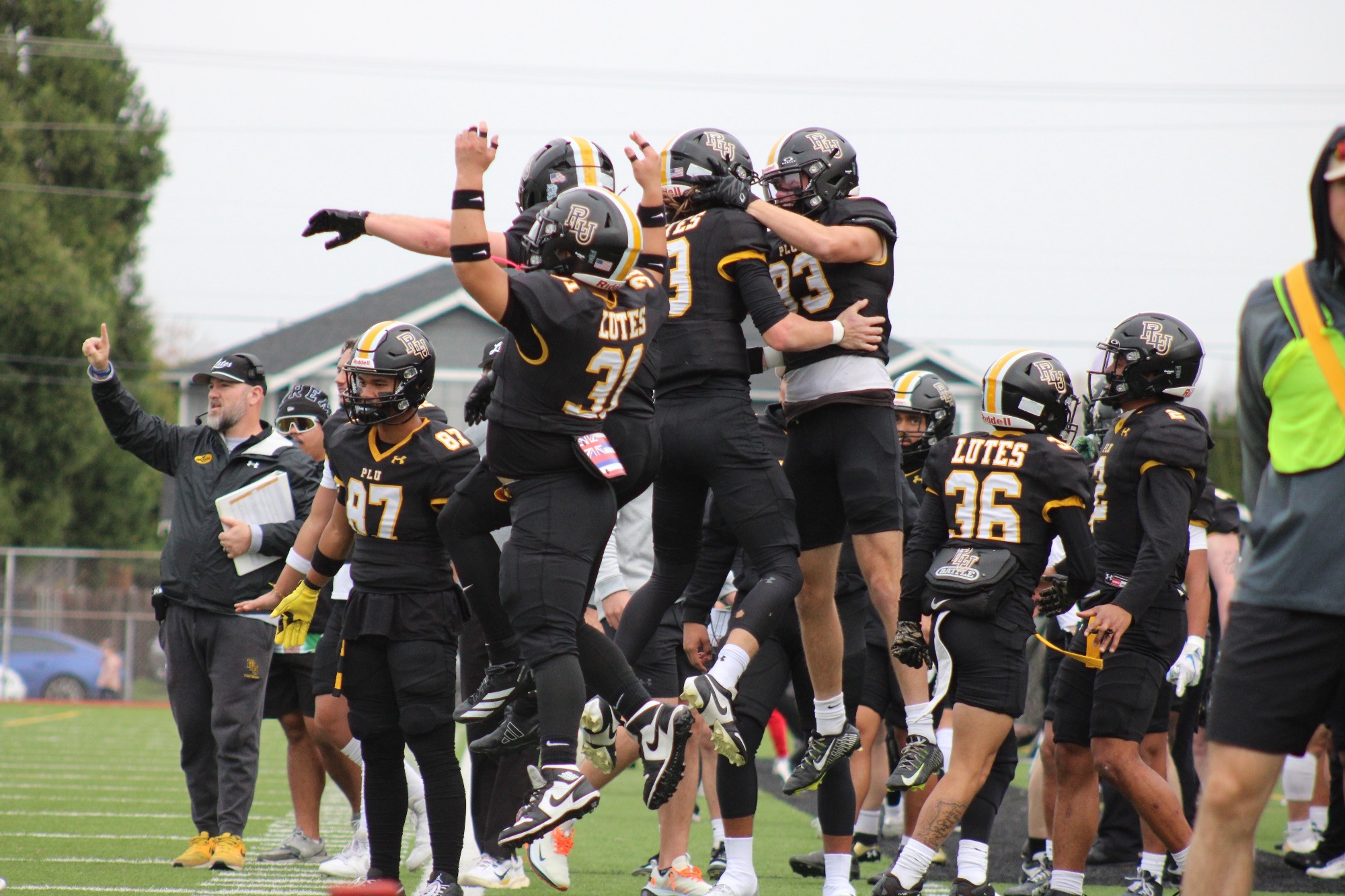 sideline celebration in win over George Fox on senior day