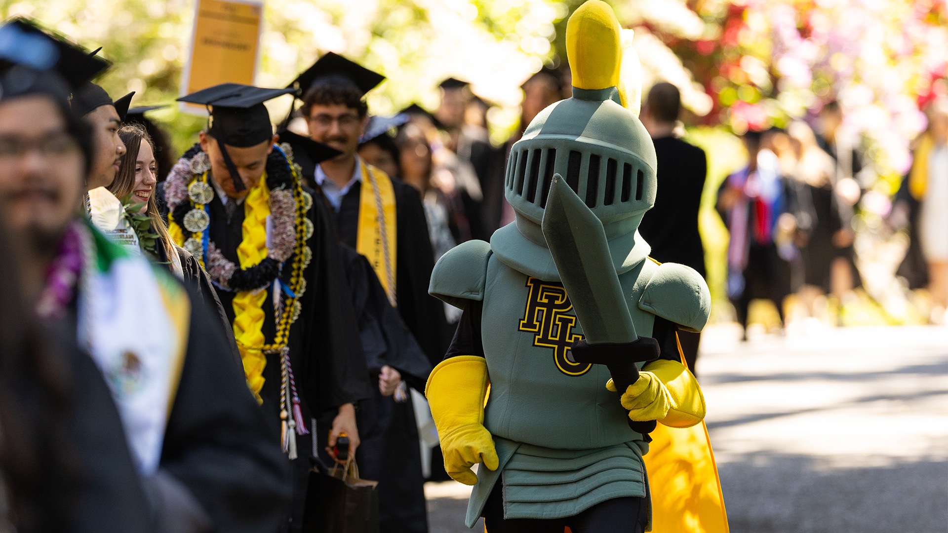 LanceLute walking to Olson Gymnasium for Commencement 2026