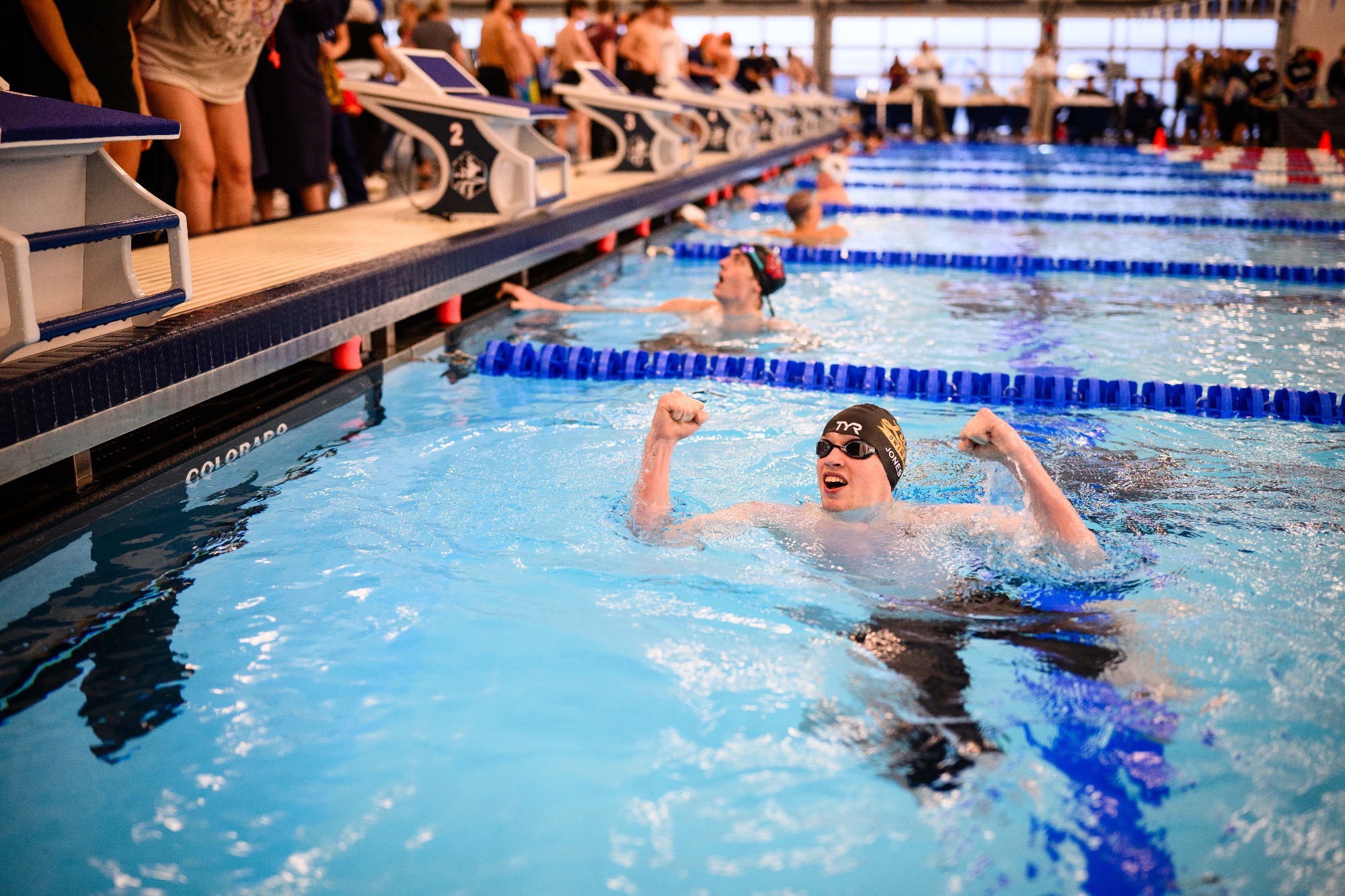 Matt Jones celebrates in pool in Boise at 2026 NWC Meet