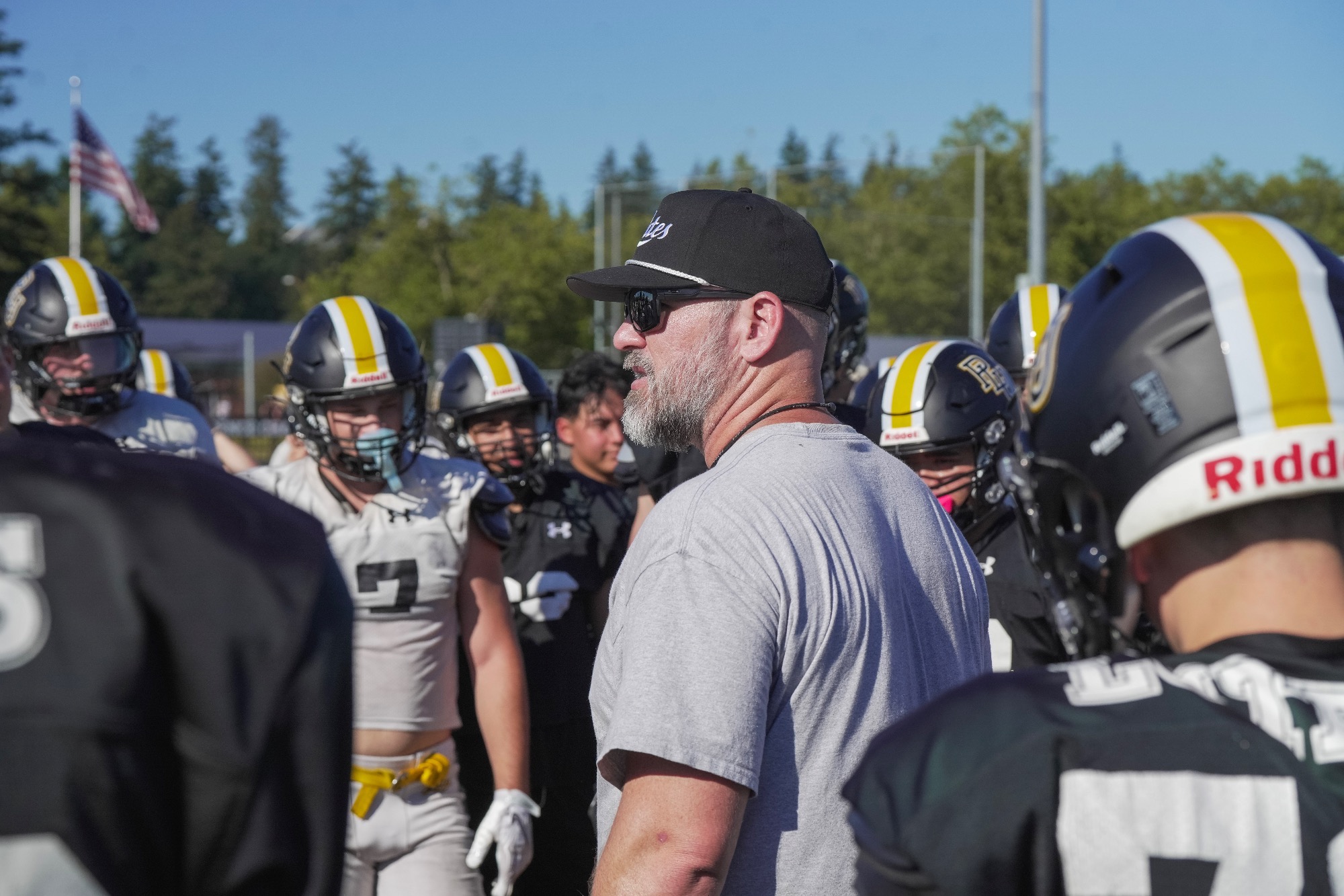 Brant McAdams in huddle at preseason practice 2026
