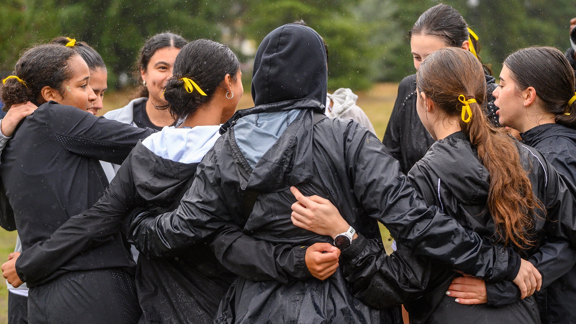 team huddle at 2025 NWC Champs