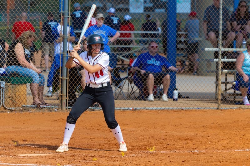 Makenzie Foster bats against Marian University JV