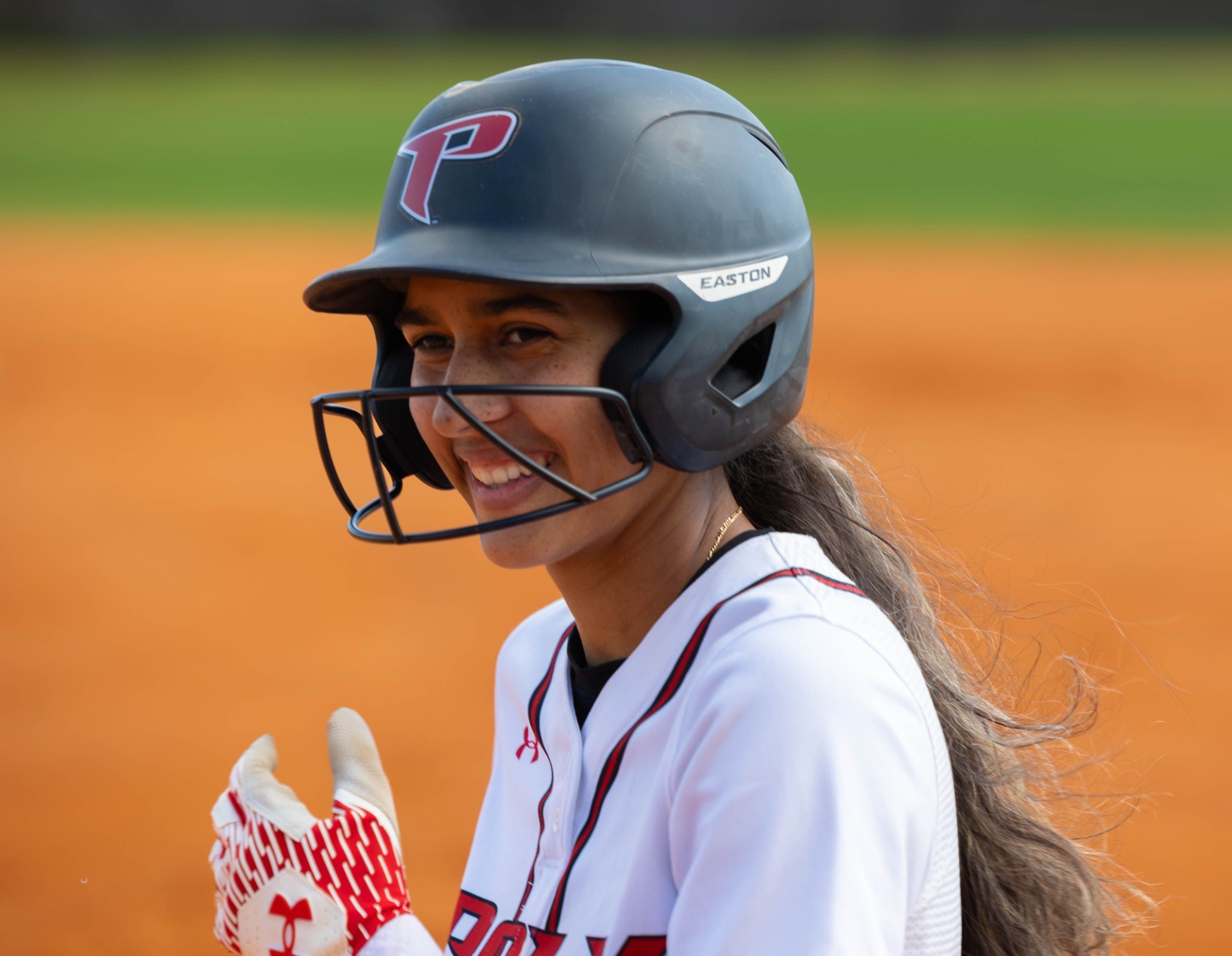 Veronica Fernandez smiles after reaching base safely