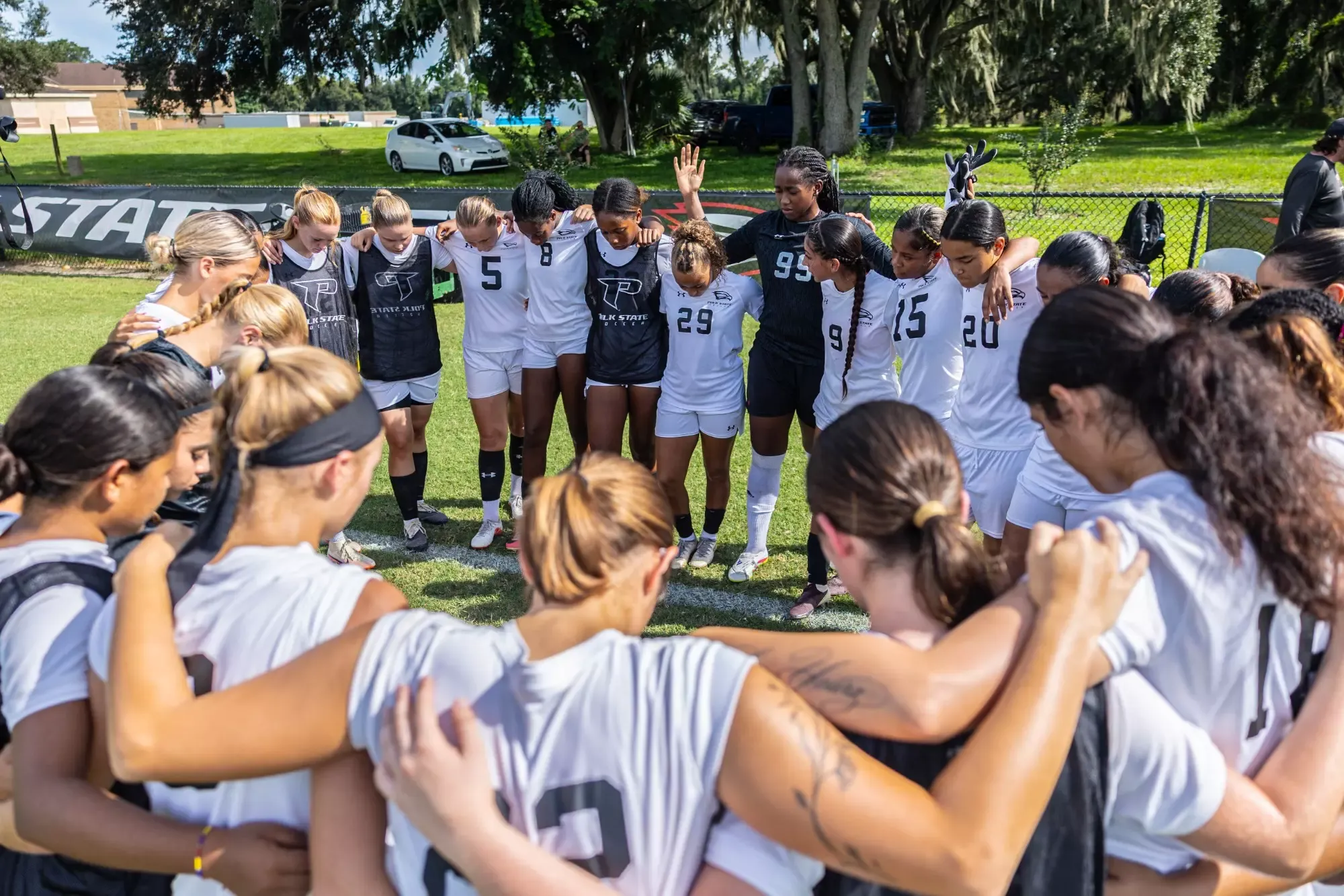 Polk State players gather pregame before a match against Daytona State College.