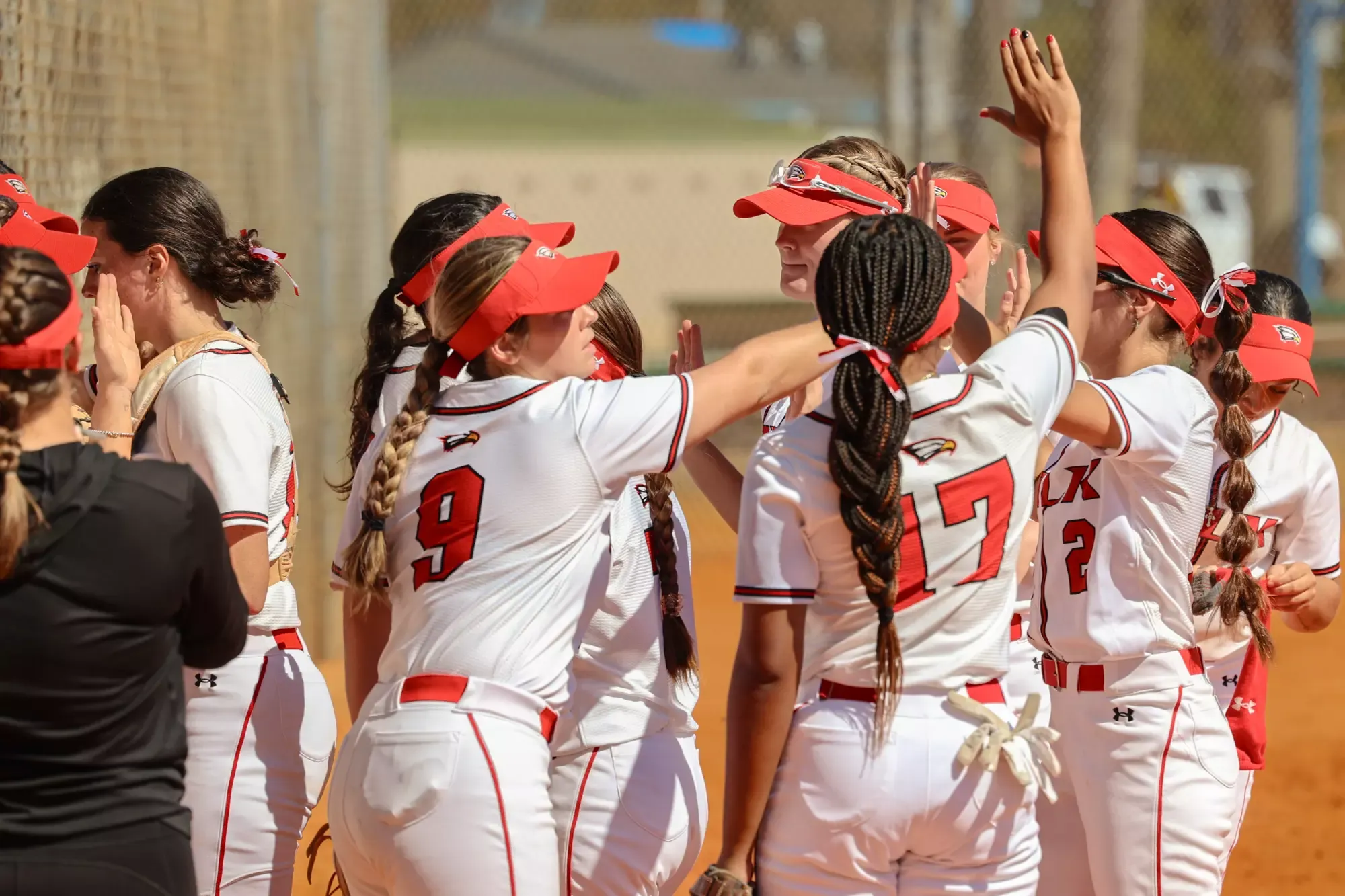 Polk State players head back to the dugout in between innings