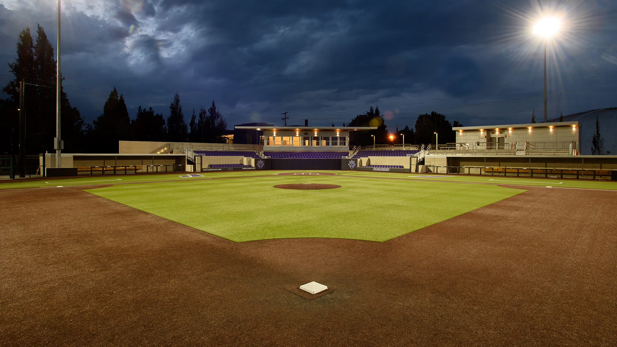 A night picture of a renovated Joe Etzel Field, UP's baseball stadium