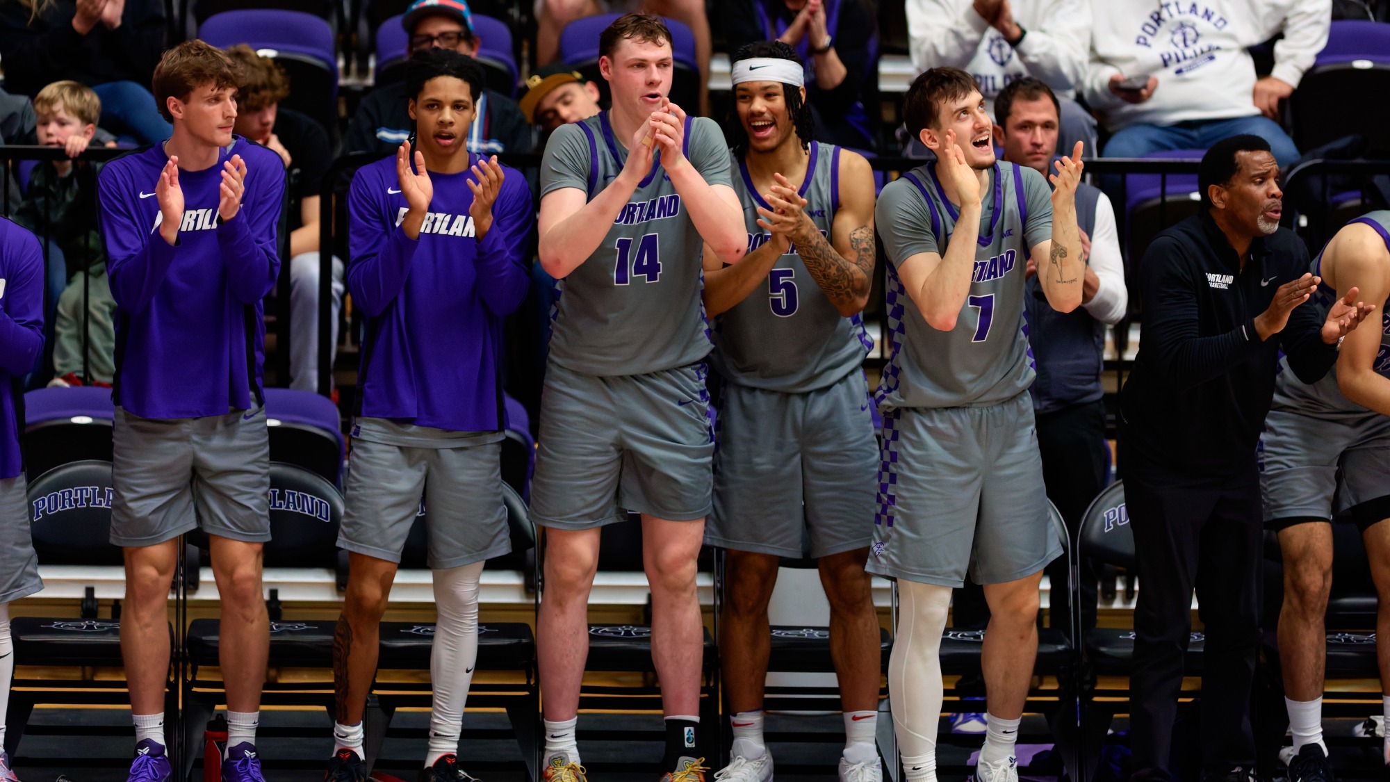 The Pilot bench celebrates a basket in the second half against Long Beach State.
