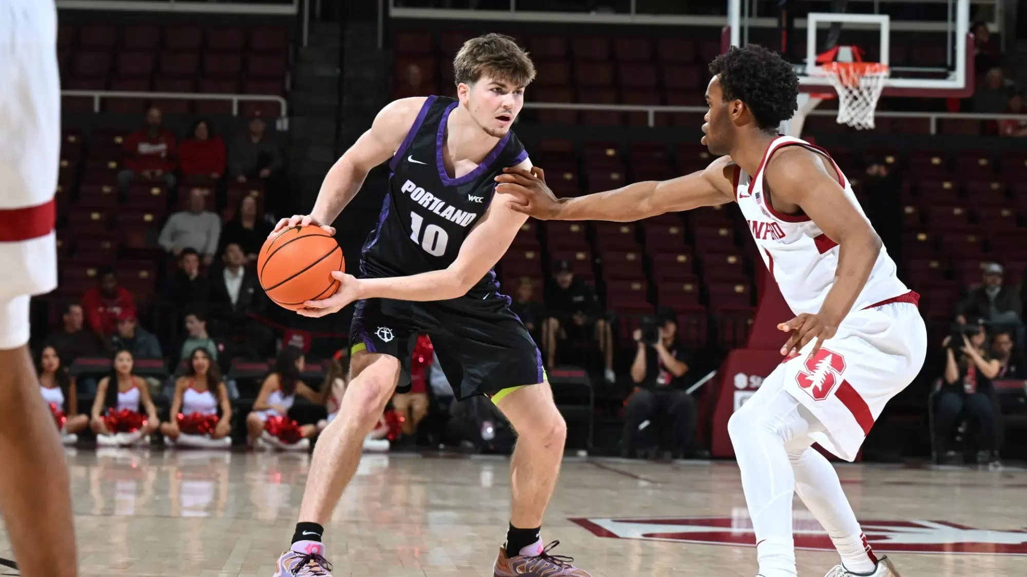 Garrett Nuckolls surveys the court in a road game at Stanford.