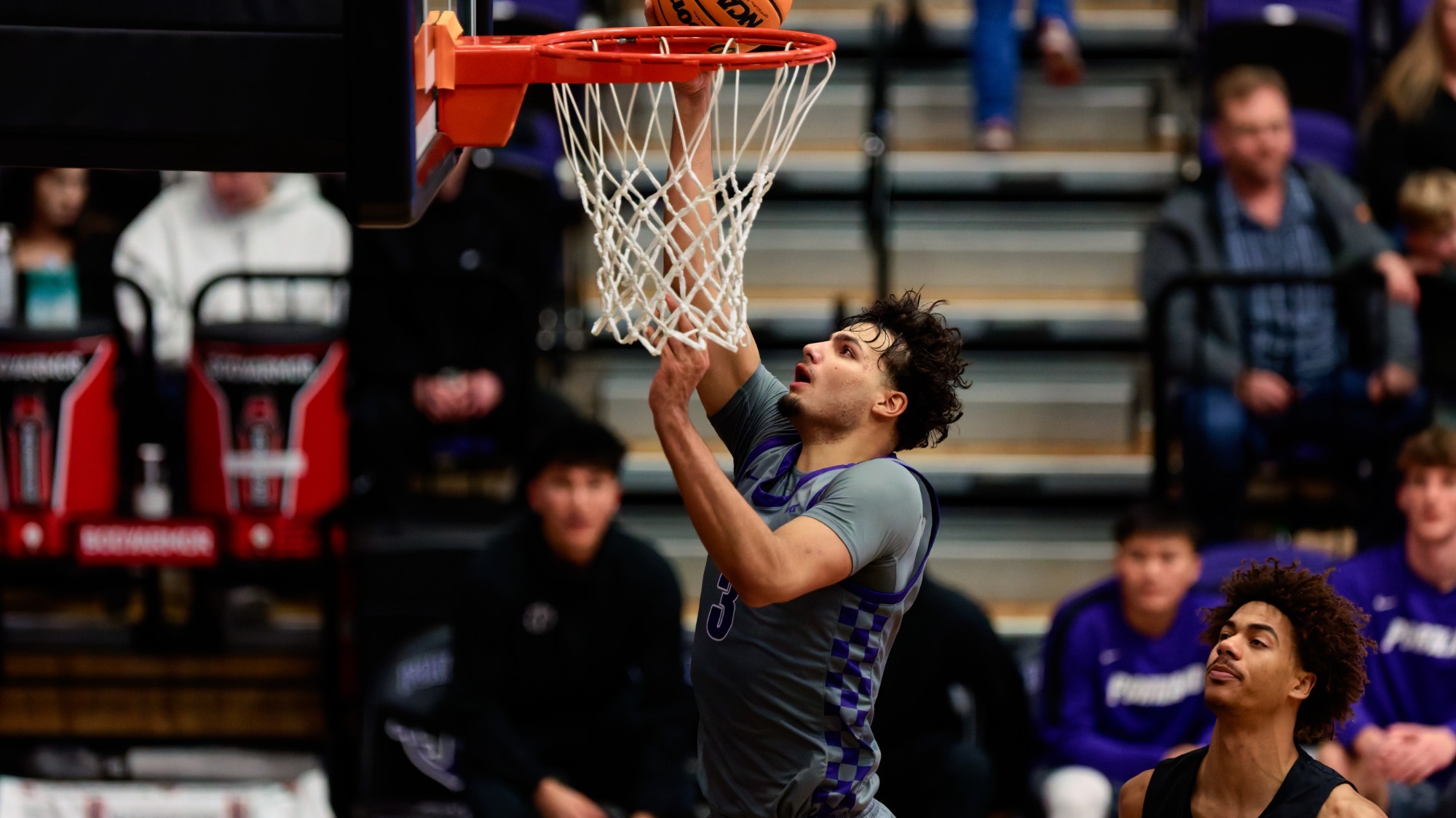 Timo George converts a layup in a home game against Long Beach State.