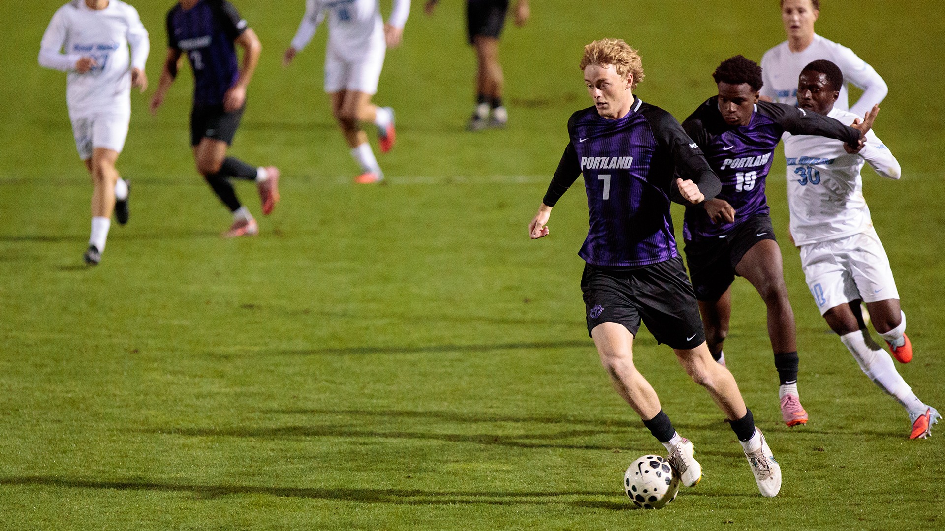 Joe Highfield dribbles down the field.