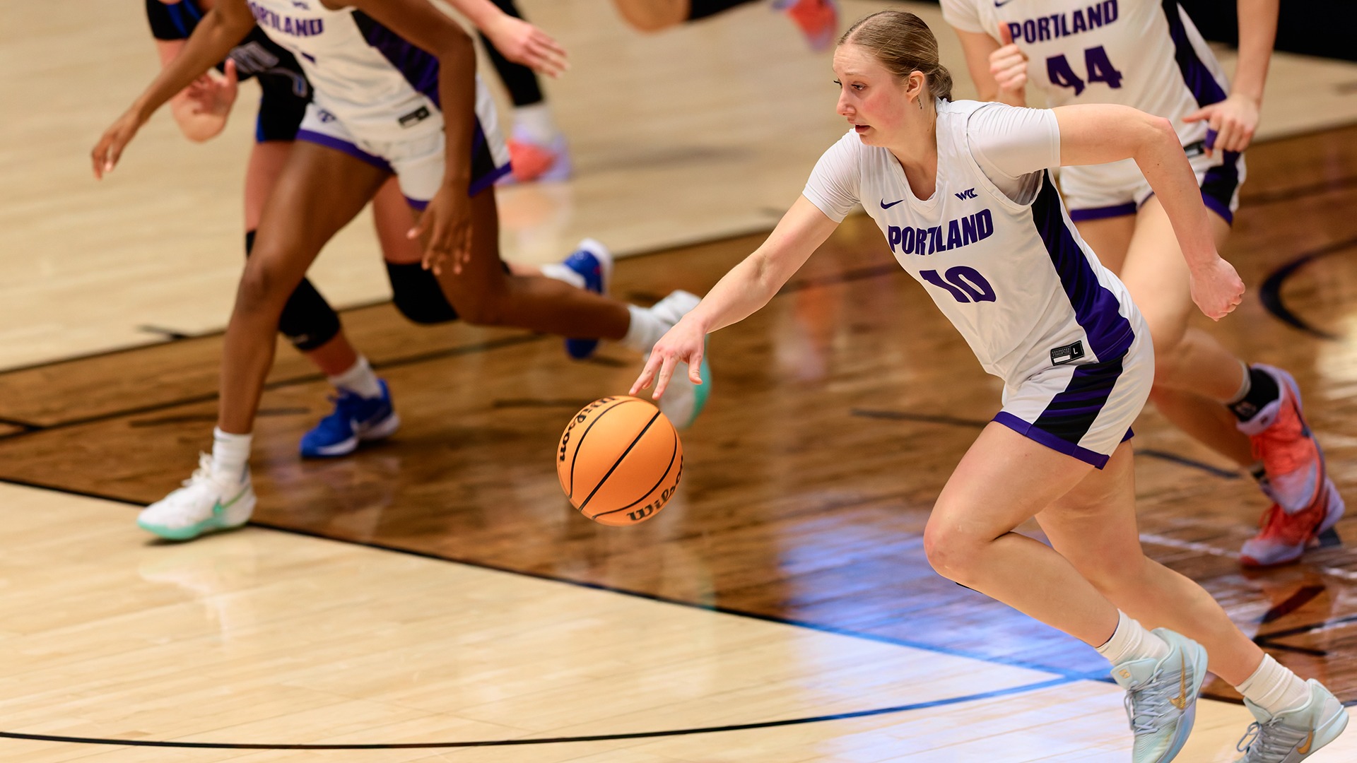 Natalie Fraley dribbles down the court.