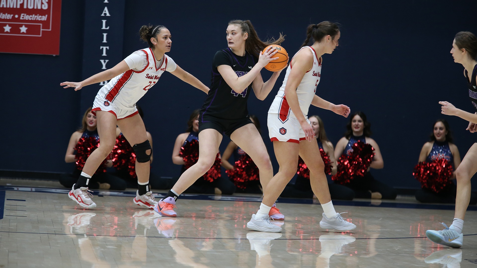 Julia Dalan works in the post against a Saint Mary's defender.