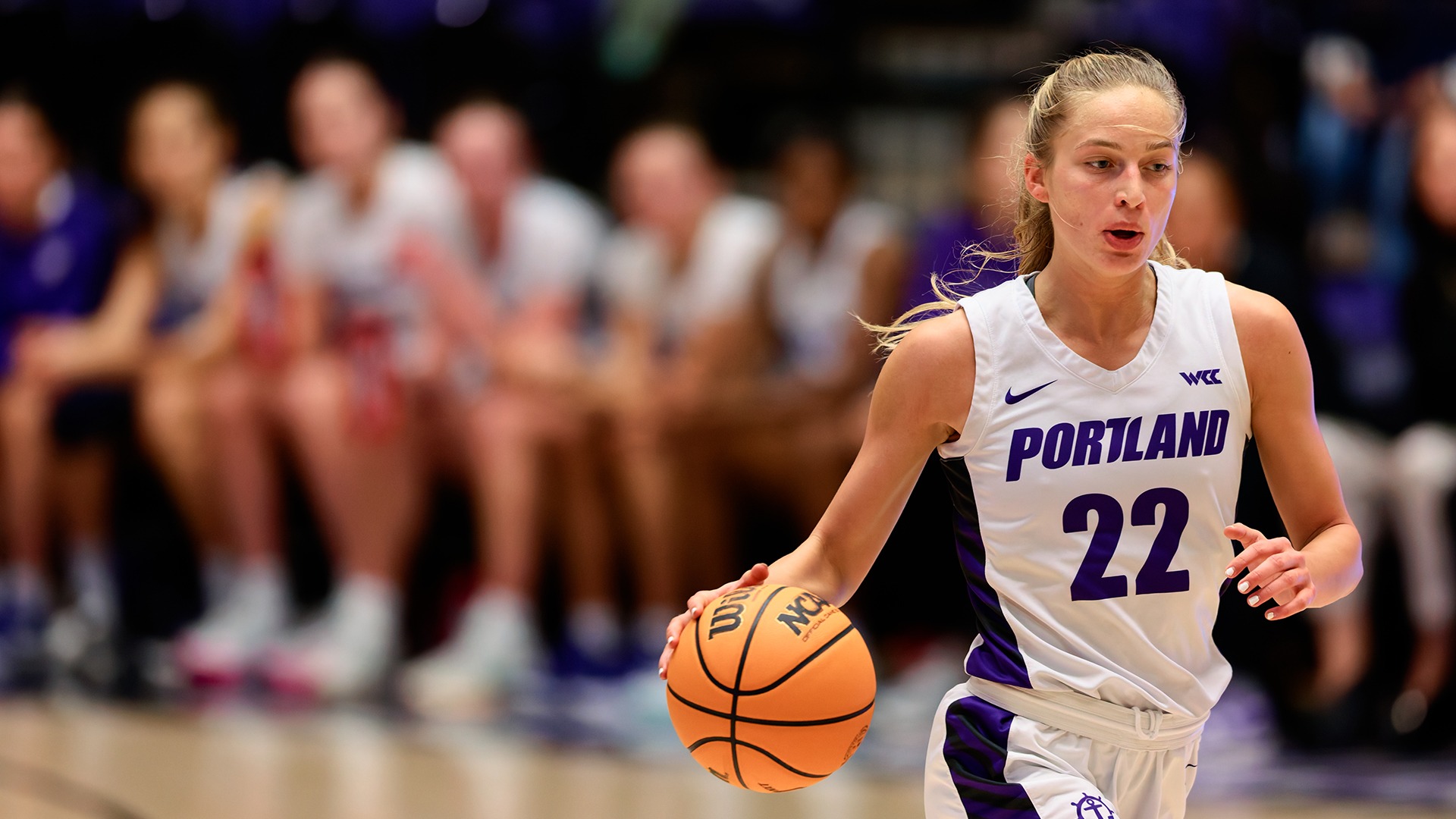 Rhyan Mogel dribbles down the court.