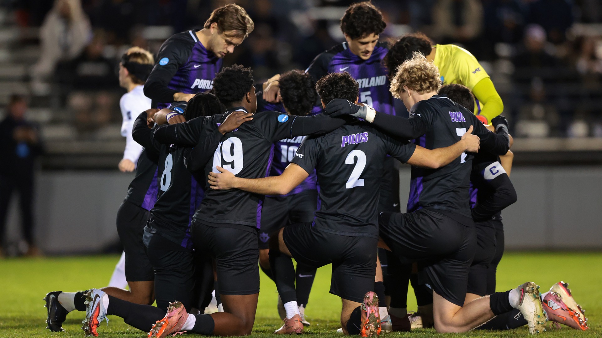 The Pilots huddle one last time on Merlo against Furman.