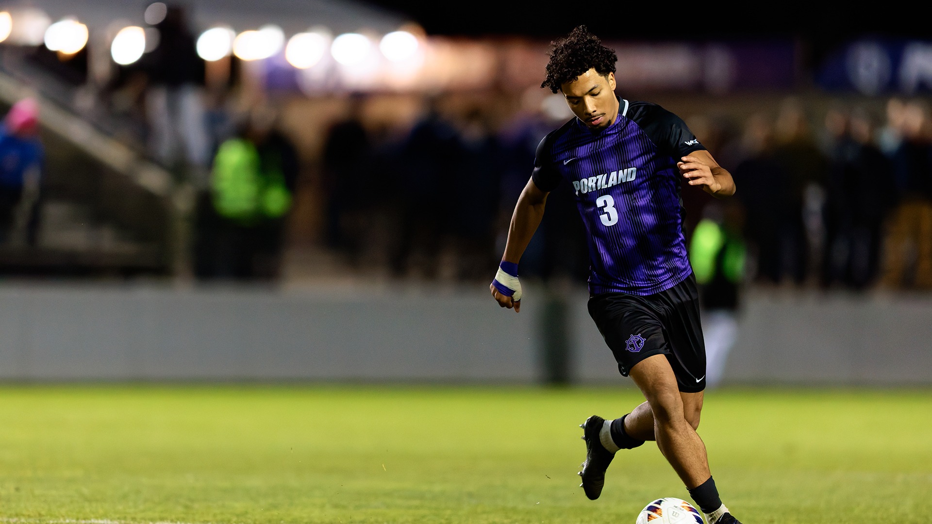 Nikos Clarke-Tosczak moves the ball downfield.