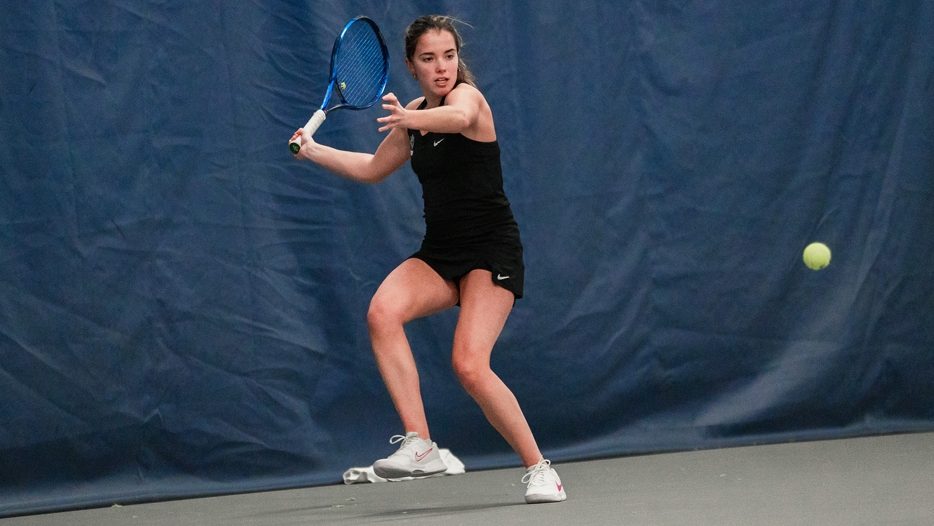 Nadine Arbaizar Martinez hits a forehand in a home match vs. Portland State.