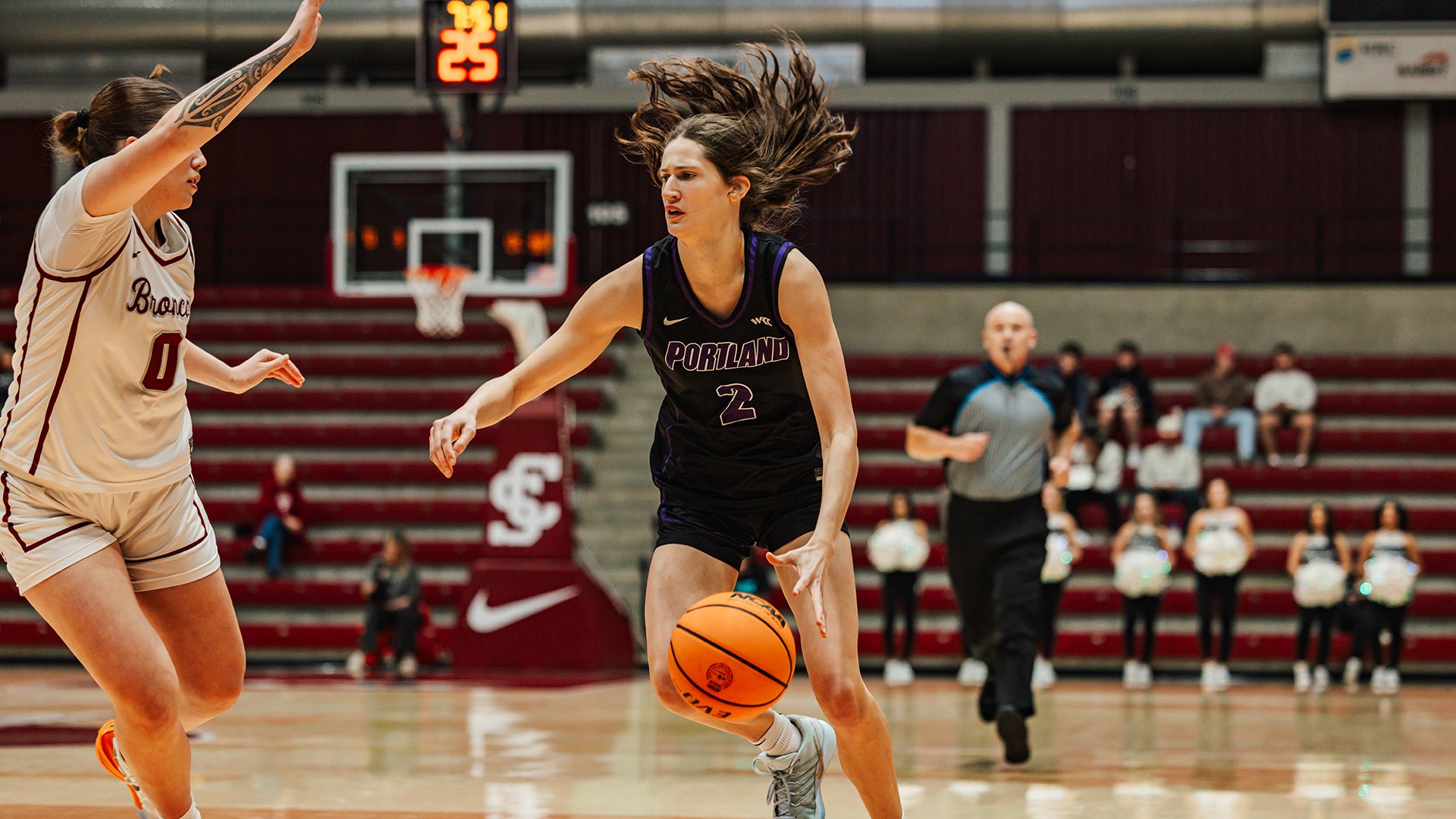 Dyani Ananiev drives to the hoop against the Broncos.