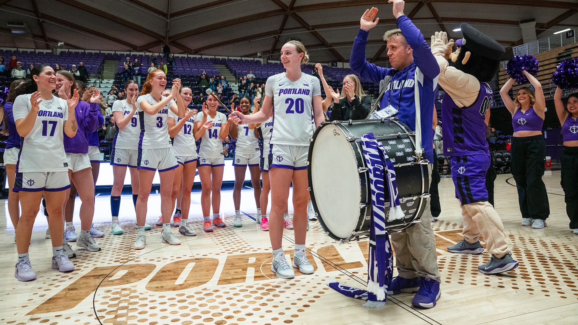 Lainey Spear bangs the drum after a win over Seattle U.
