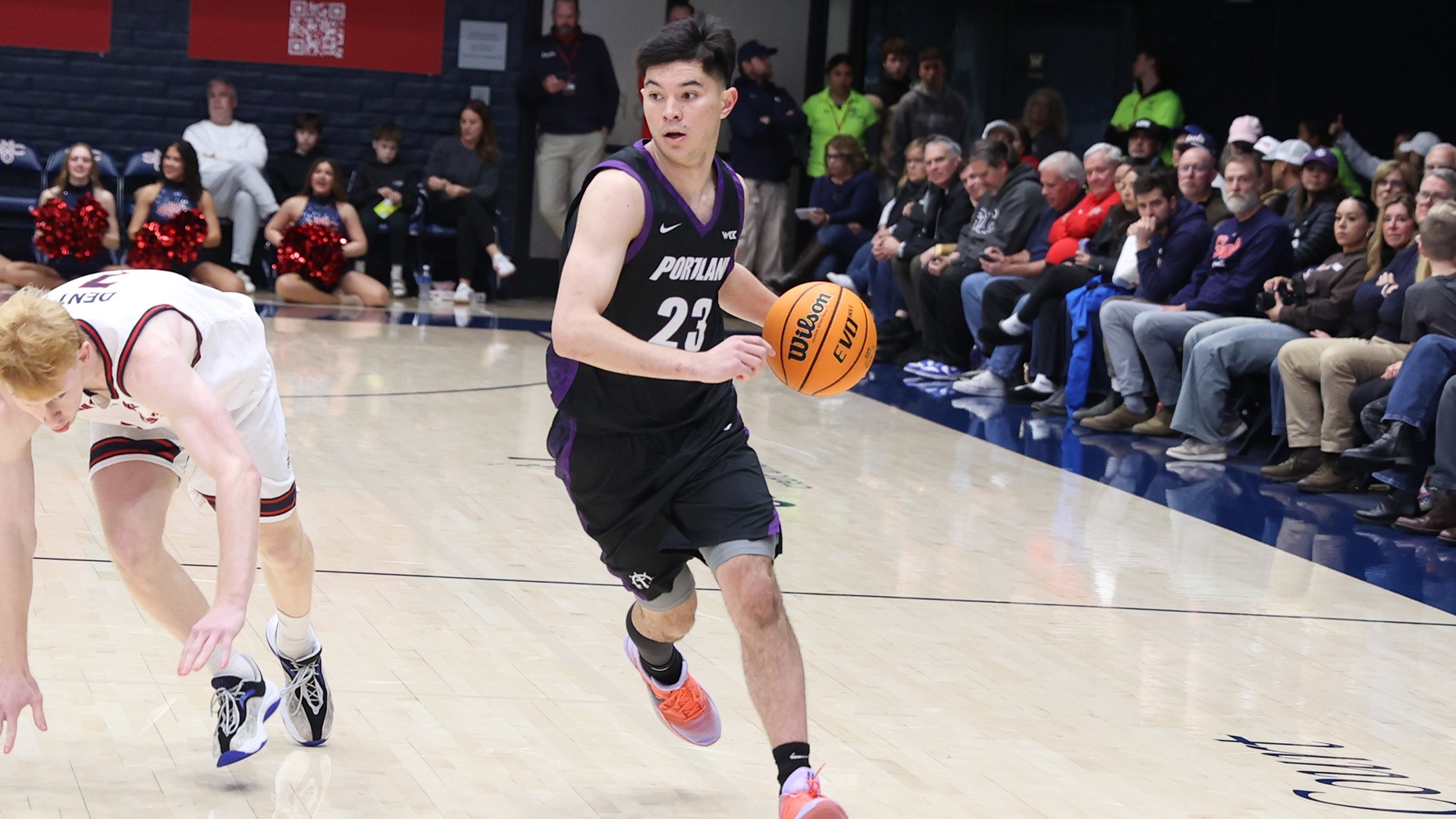 Joel Foxwell dribbles past a Saint Mary's defender.