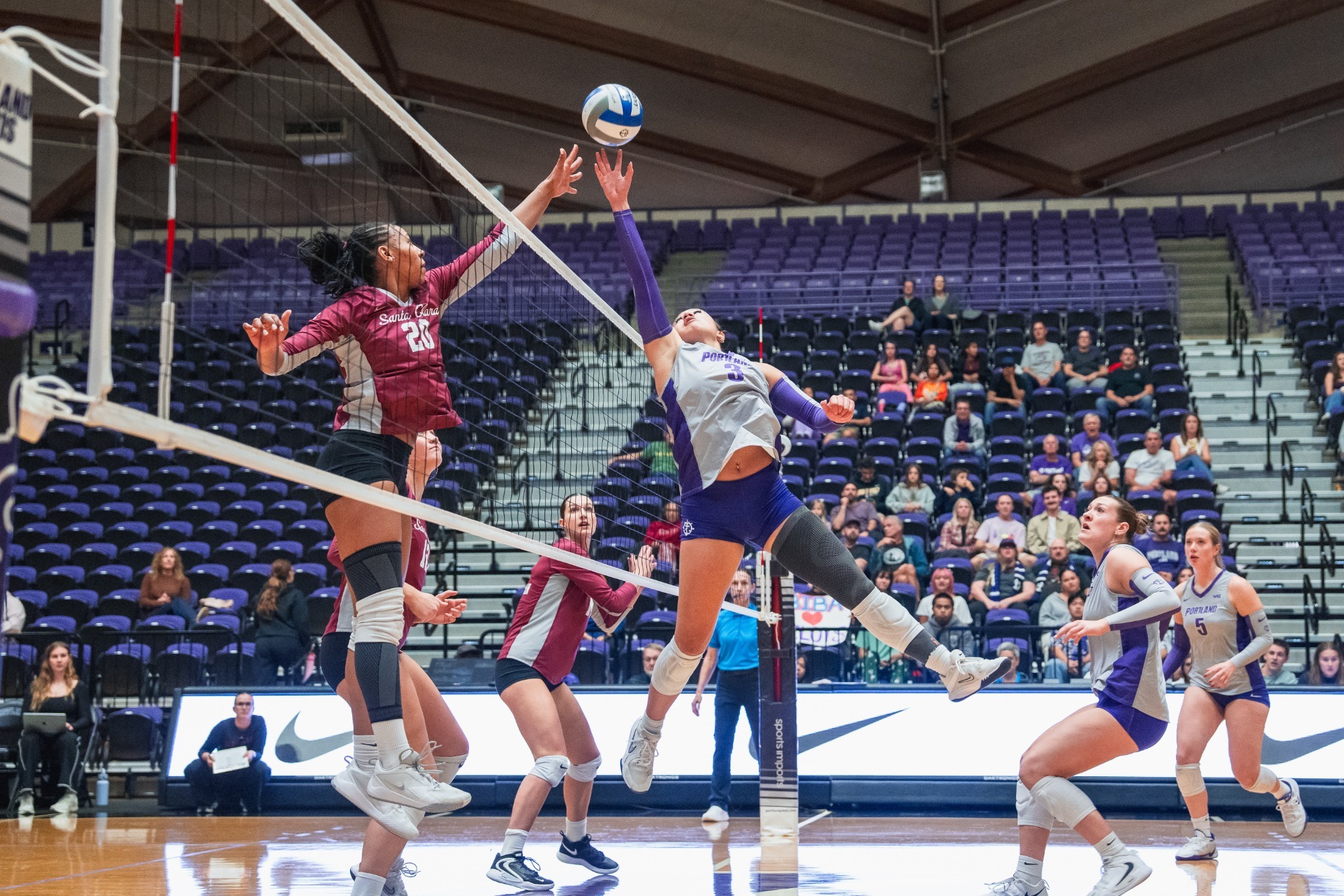 Havannah Hoeft reaching ball over net
