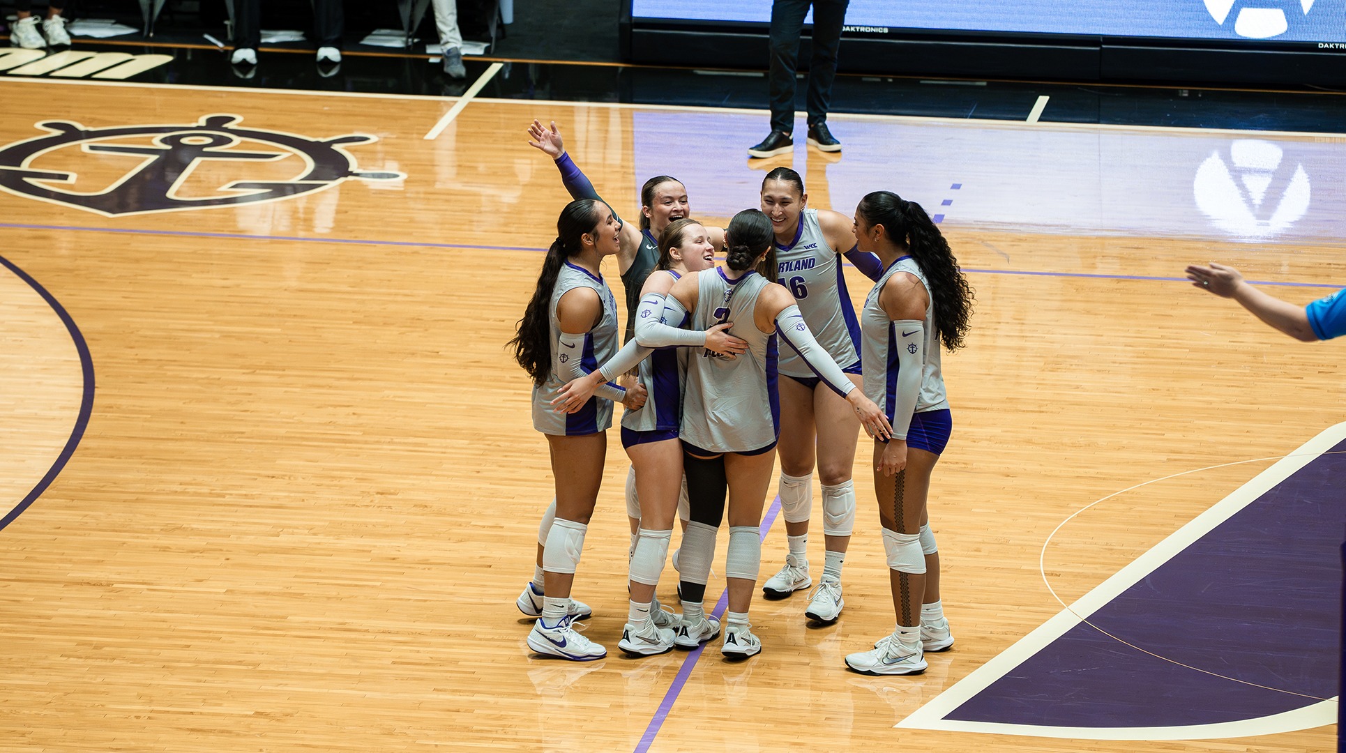 The Pilots huddle up after scoring.